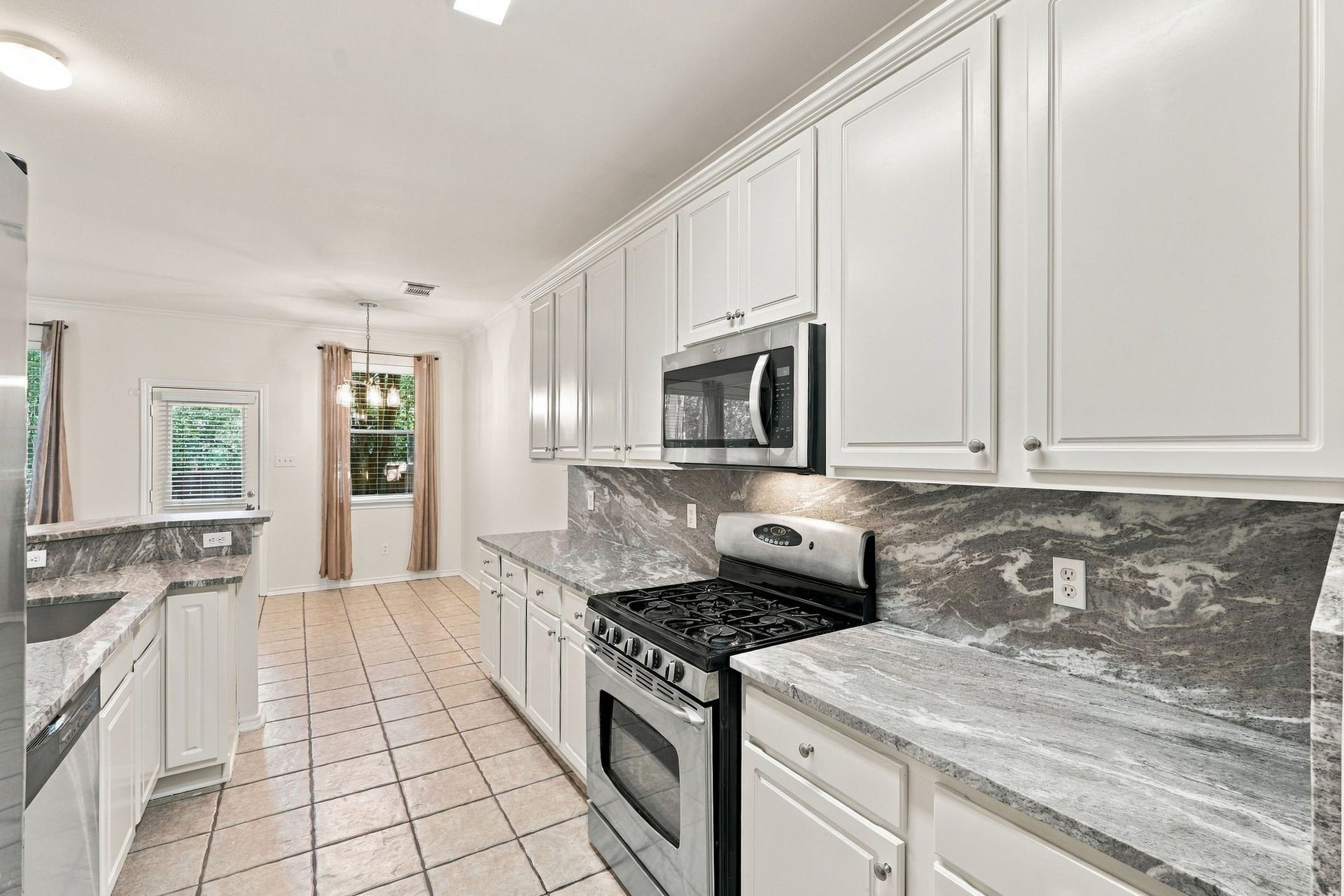 142 N Camellia Grove Circle, The Woodlands, TX 77382 Be the first to enjoy these newly installed luxury granite counters, microwave, dishwasher and sink. The cabinets have just been painted, and there are two large pantries that offer a significant amount of storage.