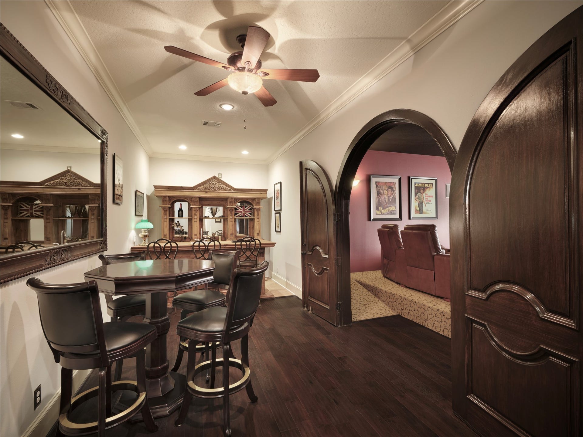 6702 Star Ledge Court, Spring, TX 77389 CLUB LOUNGE Serving as the centerpiece of the homes upper-level entertainment wing, this elegant gathering space features a built-in wet bar, display cabinetry, and a pub-height dining area. Perfectly positioned adjacent to the Media Room and Billiards & Game Room, it creates a natural destination for conversation, refreshments, and effortless entertaining.