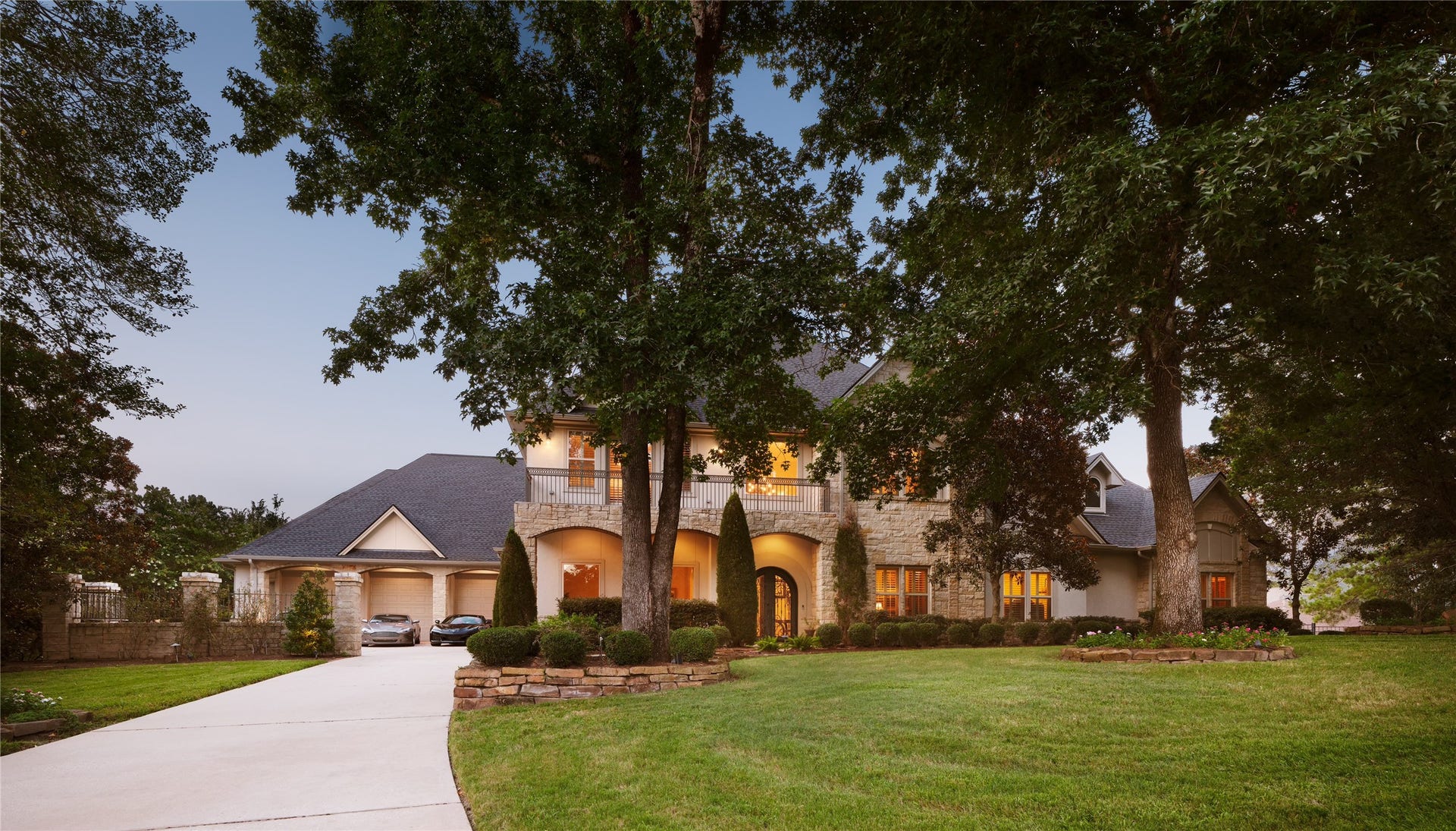 6702 Star Ledge Court, Spring, TX 77389 First Impressions Nestled on a beautifully landscaped homesite beneath a canopy of mature trees, the residence makes a lasting first impression with its timeless limestone faade, gracious front porch, and stately architectural presence. A sweeping drive leads to the oversized garage and welcoming entrance, while the expansive front lawn and established landscape create a rare sense of privacy and distinction. Elegant by design and enduring in character, the home reflects a true custom estate