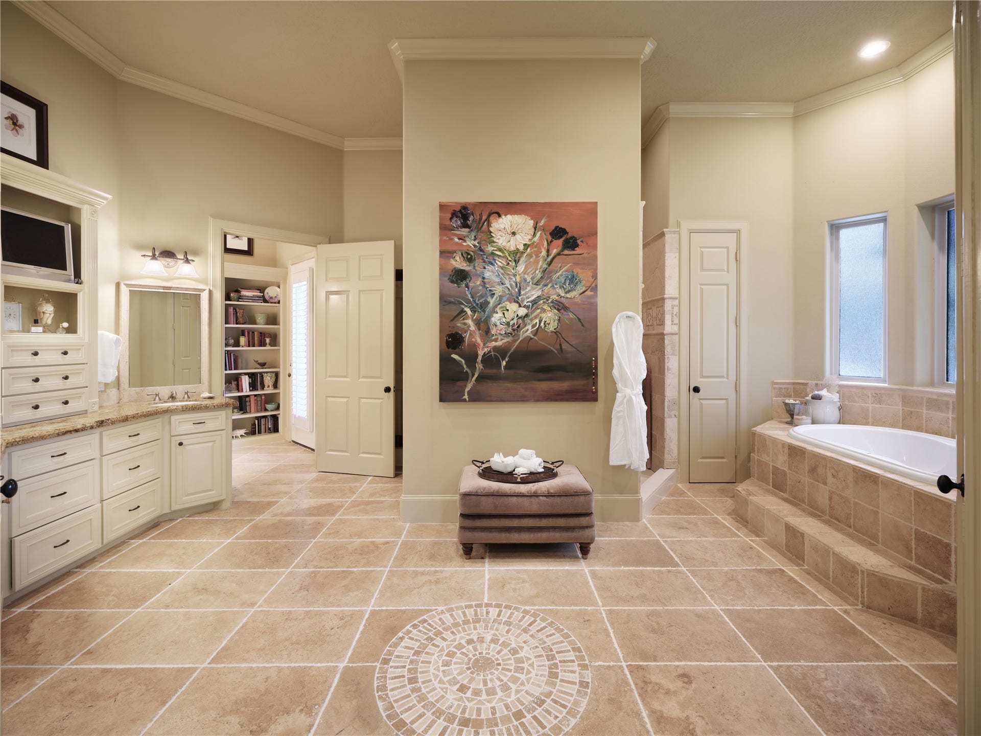 6702 Star Ledge Court, Spring, TX 77389 PRIMARY BATH Generously proportioned and thoughtfully designed, the primary bath offers dual vanities, an expansive walk-in shower, a soaking tub, and abundant storage. Filled with natural light and finished with timeless materials, the space is complemented by an oversized walk-in closet with custom built-ins, creating a comfortable and highly functional owners retreat with exceptional potential for future personalization.
