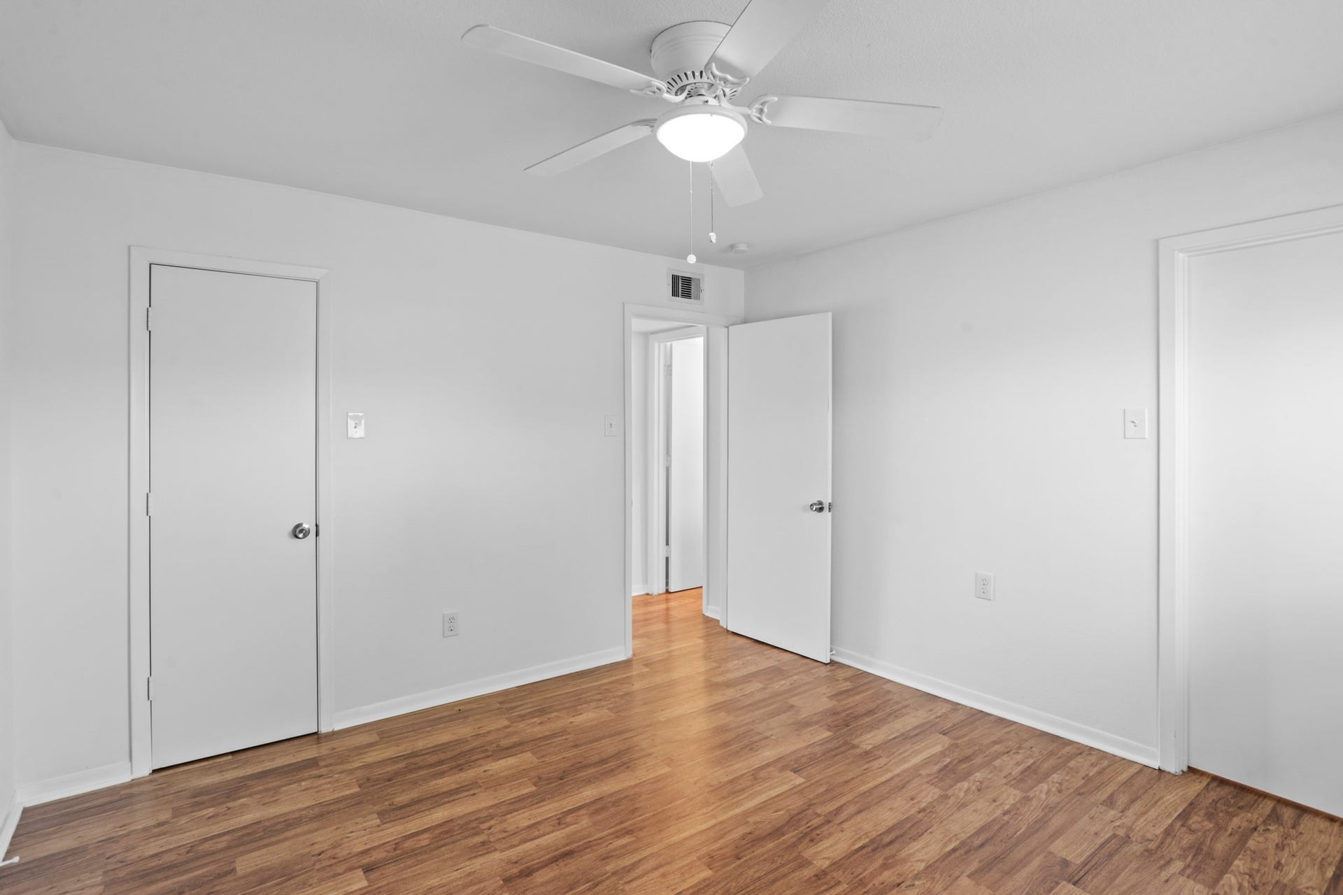 1408 Hughes Street, #11, Houston, TX 77023 Both closets are shown in this bedroom picture.