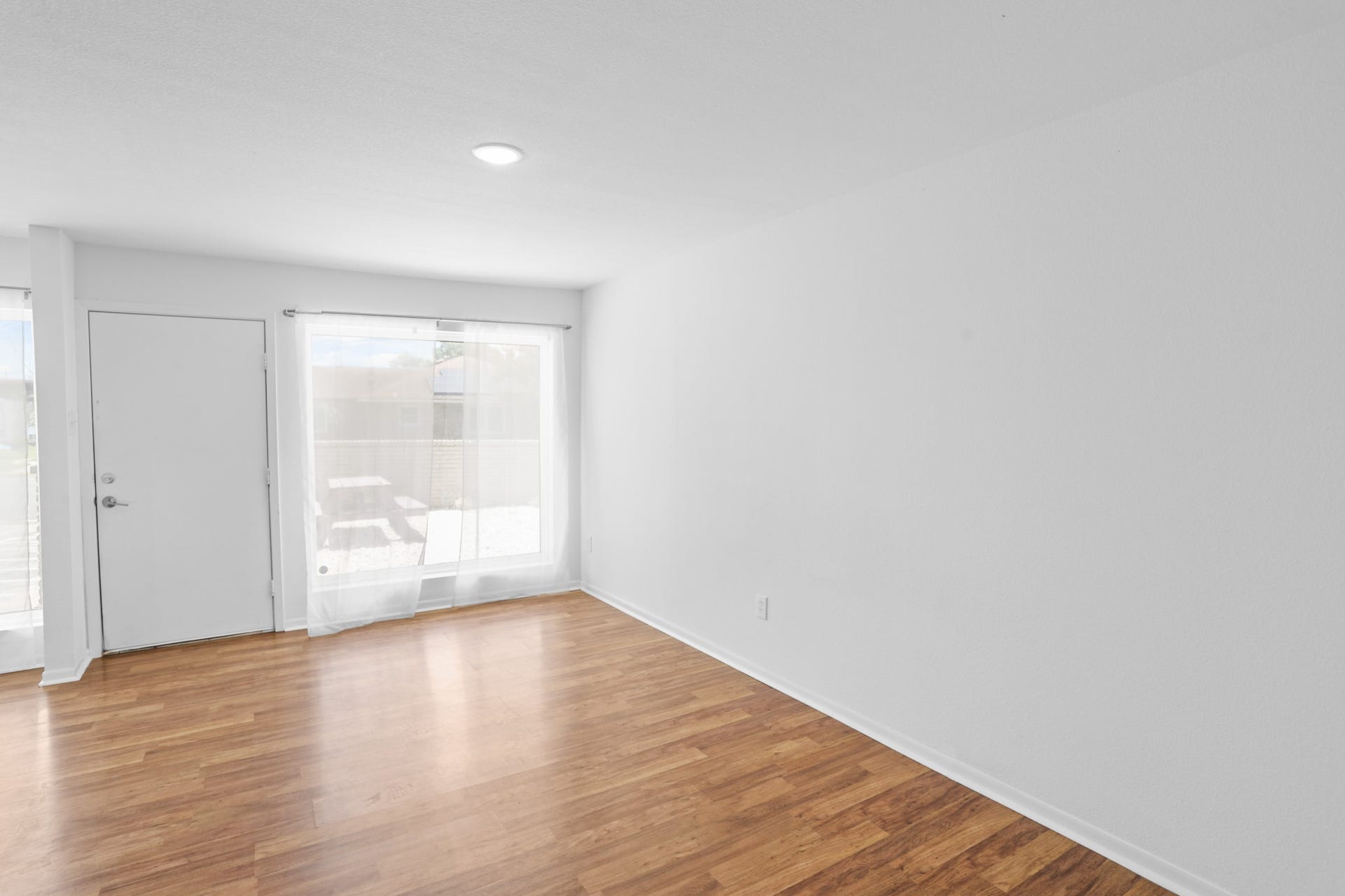 1408 Hughes Street, #11, Houston, TX 77023 Another view of the living space with a large picture window.