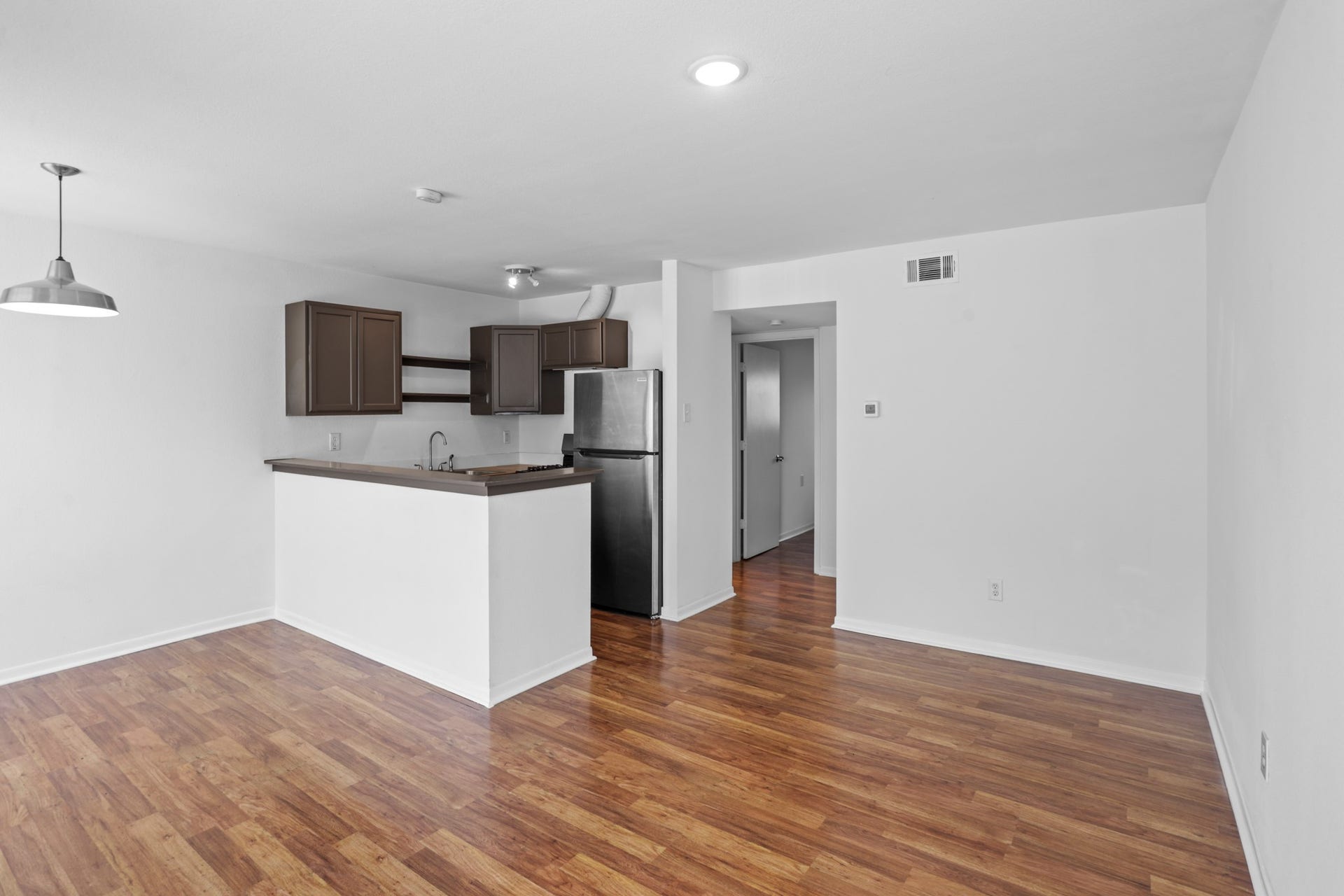 1408 Hughes Street, #11, Houston, TX 77023 The living, dining areas and kitchen are open concept for gracious living and entertaining.