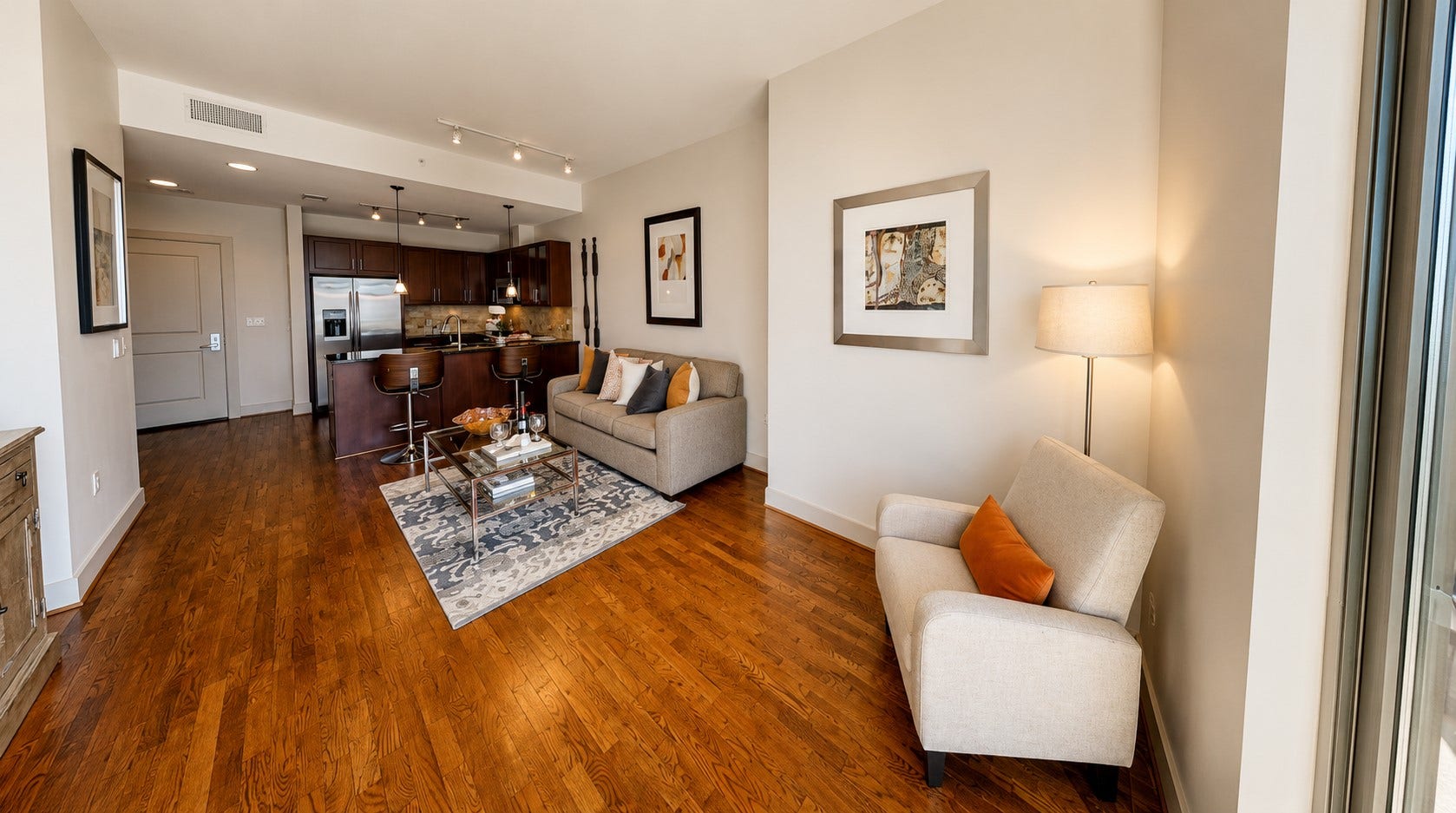One of the nicest things about this layout is how naturally everything connects. From the kitchen to the living room and out toward the balcony, the home feels open without losing its sense of warmth.