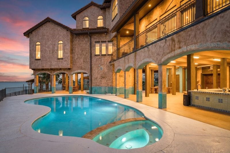 506 Sunset Circle, Tiki Island, TX 77554 Pool with large ground level entertainment space