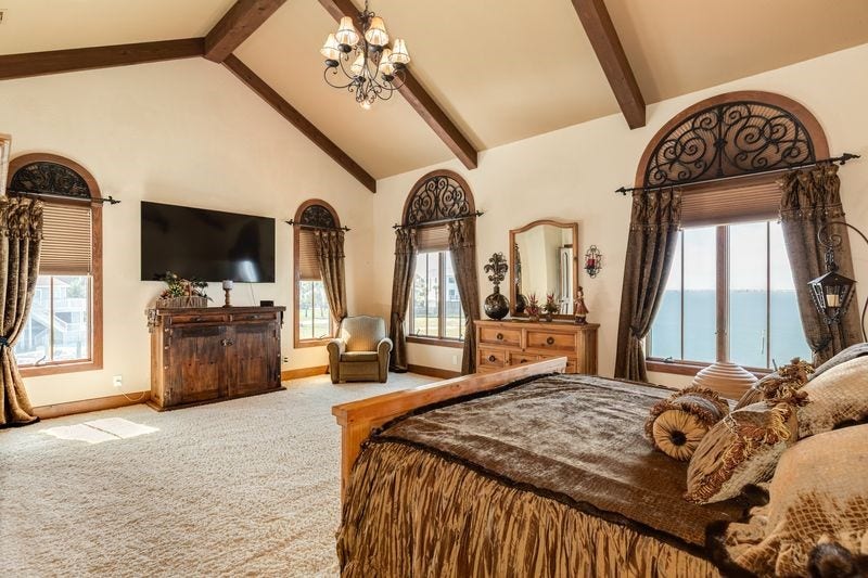506 Sunset Circle, Tiki Island, TX 77554 Primary bedroom with views of water, 1st level