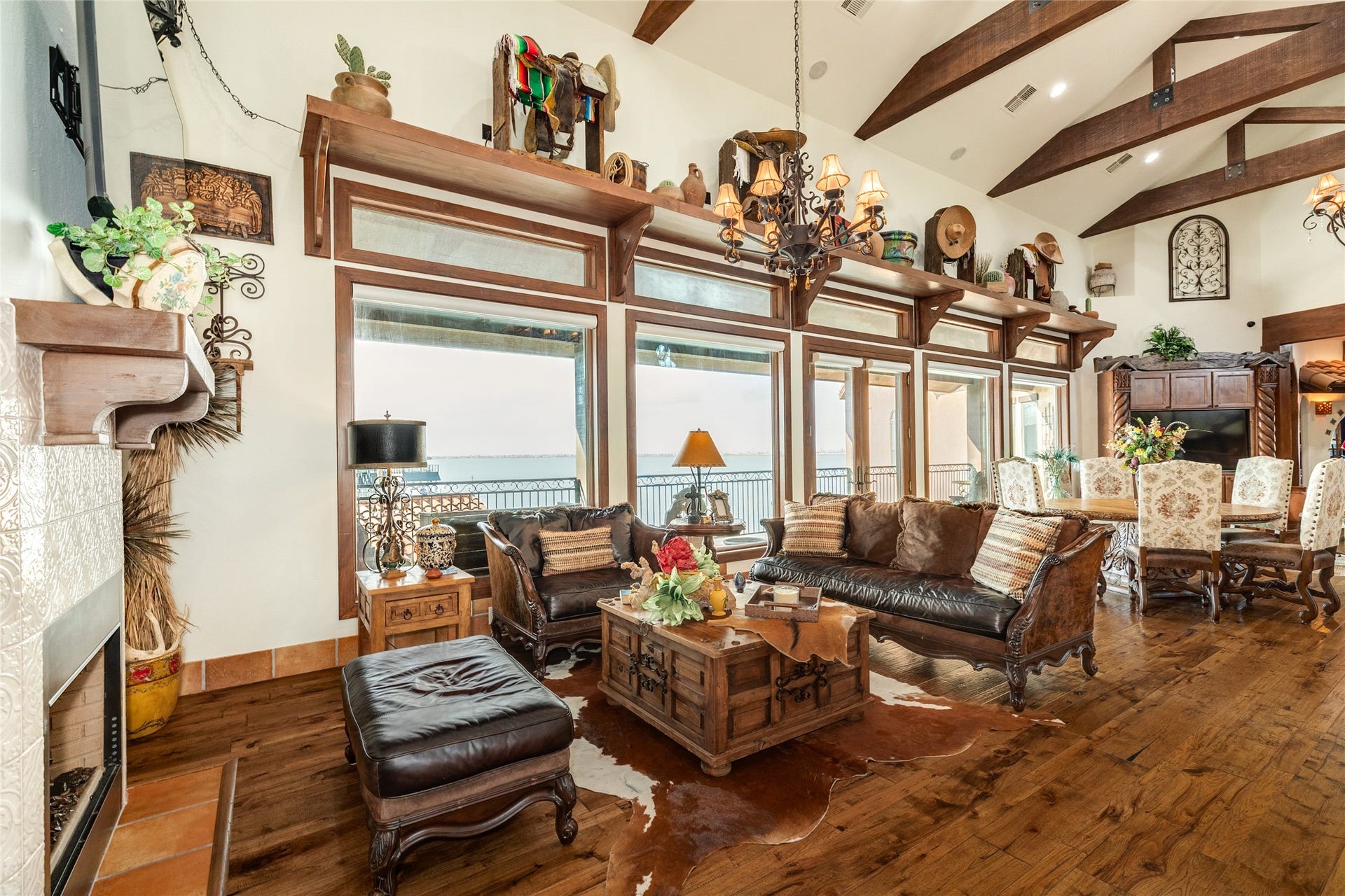 506 Sunset Circle, Tiki Island, TX 77554 Fireplace with seating area at one end of the living room