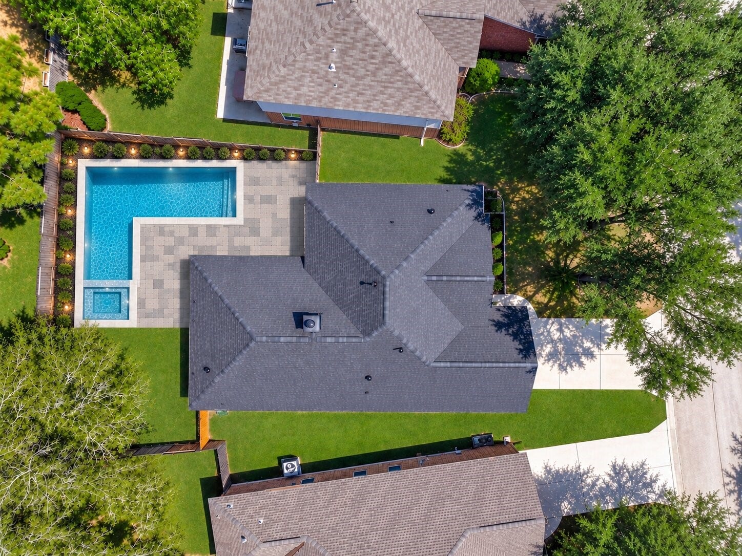 18 Griffin Hill Court, The Woodlands, TX 77382 (VIRTUALLY Enhanced PHOTO) This rendering illustrates the breathtaking potential of 18 Griffin Hill Court's spacious backyard imagine a resort-style in-ground pool paired with a beautifully paved patio designed for entertaining. The lot size and outdoor layout make this vision entirely achievable. Photo is an AI-generated rendering for illustrative purposes only and does not depict current property conditions.