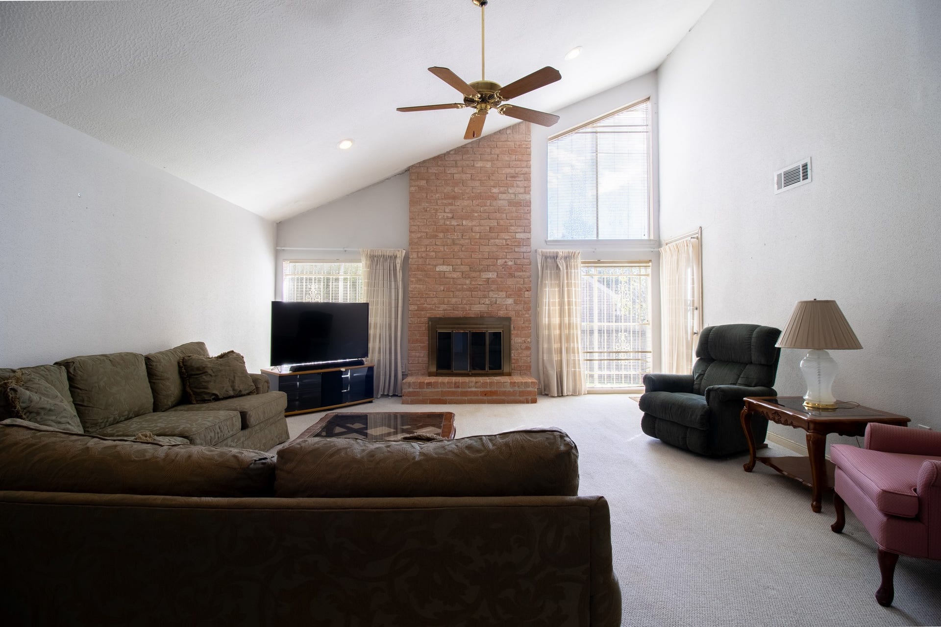 Picture movie nights, holiday gatherings, and cozy evenings around the fireplace beneath these soaring ceilings!