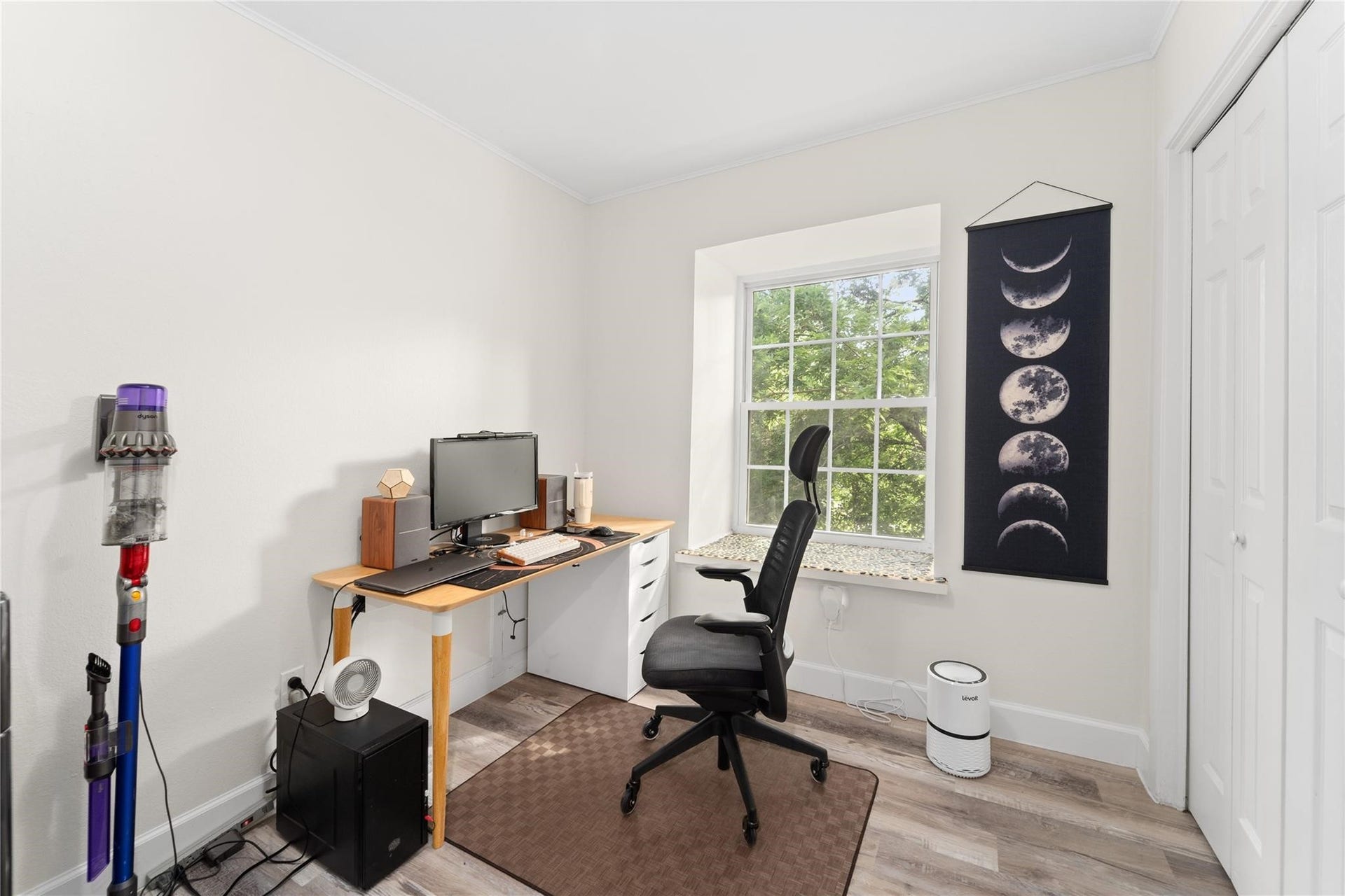 8223 Kingsbrook Road, #212, Houston, TX 77024 A bright home office with a large window, providing natural light.
