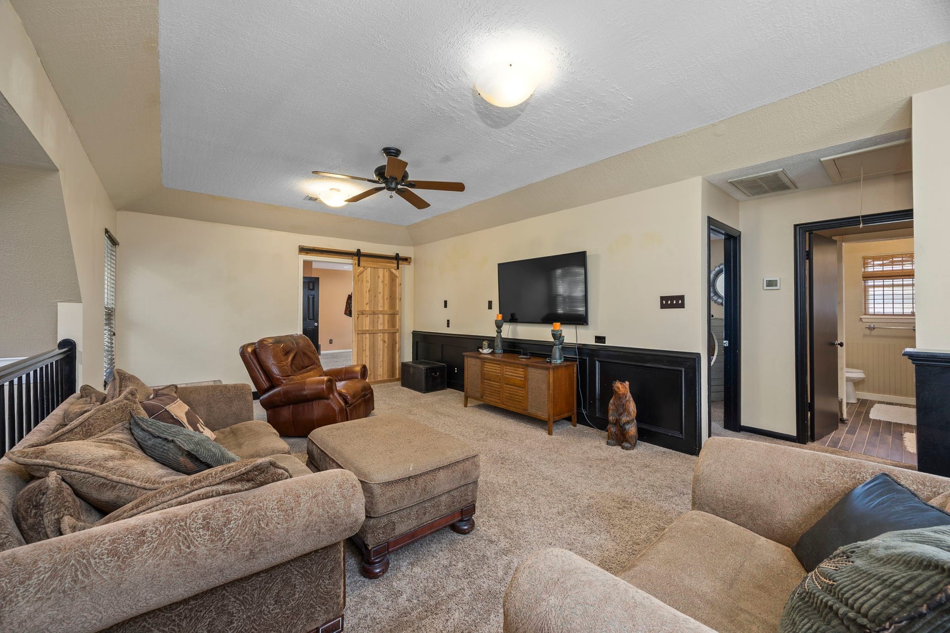 1622 Rambling Stone Drive, Richmond, TX 77406 Another view of the game room highlights the generous floor space, flexible furniture arrangement, and convenient access to the adjoining room and bathroom.