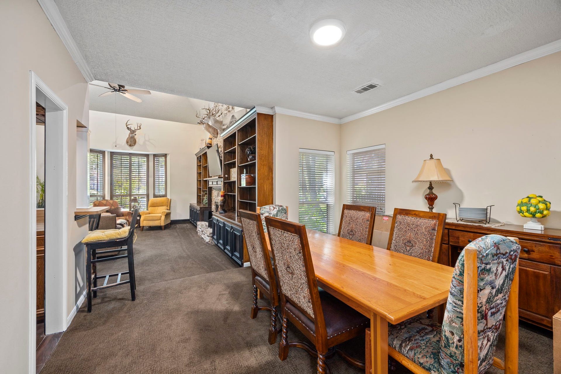 1622 Rambling Stone Drive, Richmond, TX 77406 The formal dining room offers ample space for gatherings, with convenient access to both the kitchen and main living area. Its open connection to the living room allows for an easy flow when entertaining family and friends.