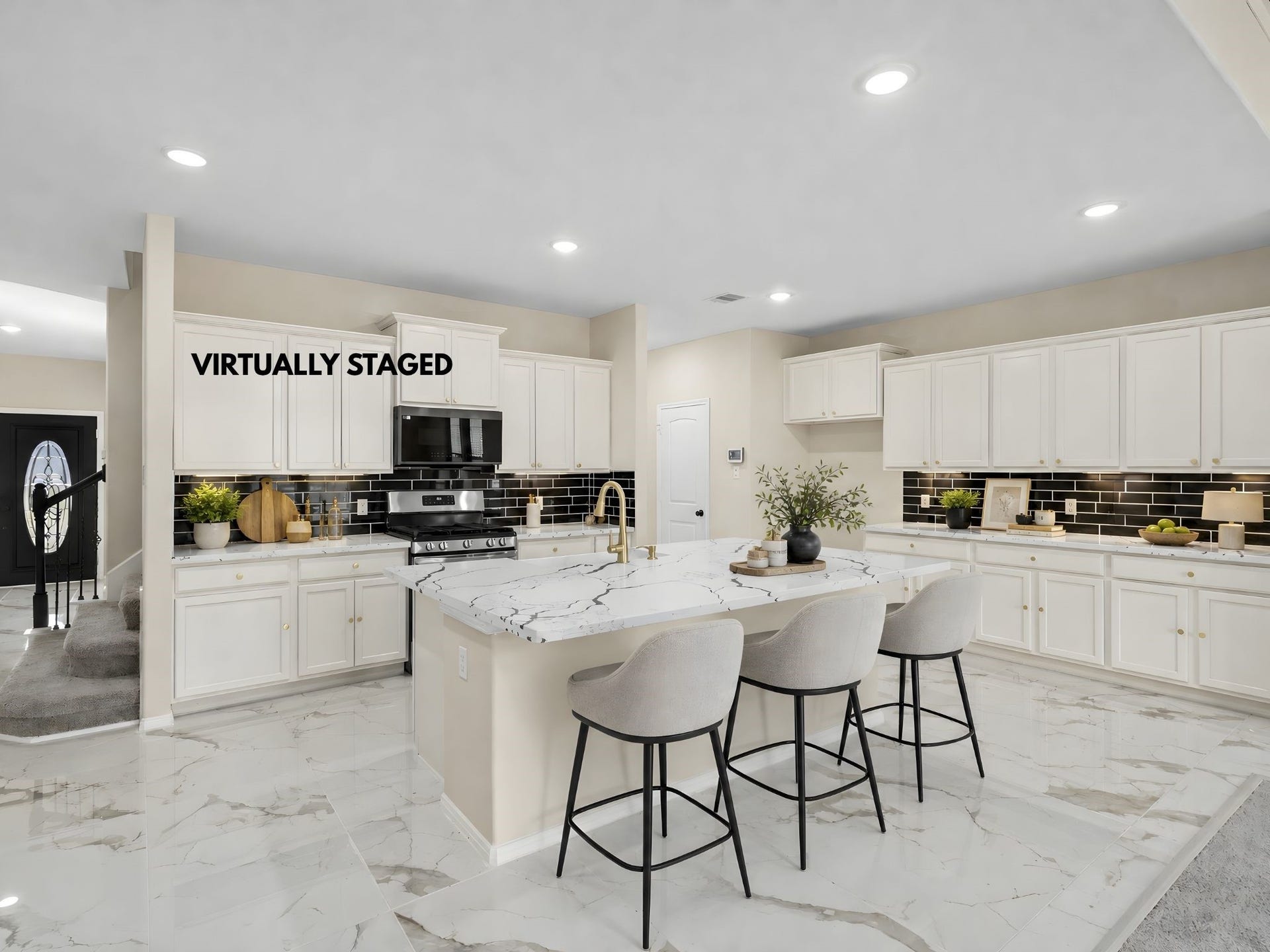 9423 Mineral Rock Lane, Richmond, TX 77407 Virtually Staged kitchen. A spacious island and marble countertops anchor this open kitchen, flowing effortlessly into the living area.