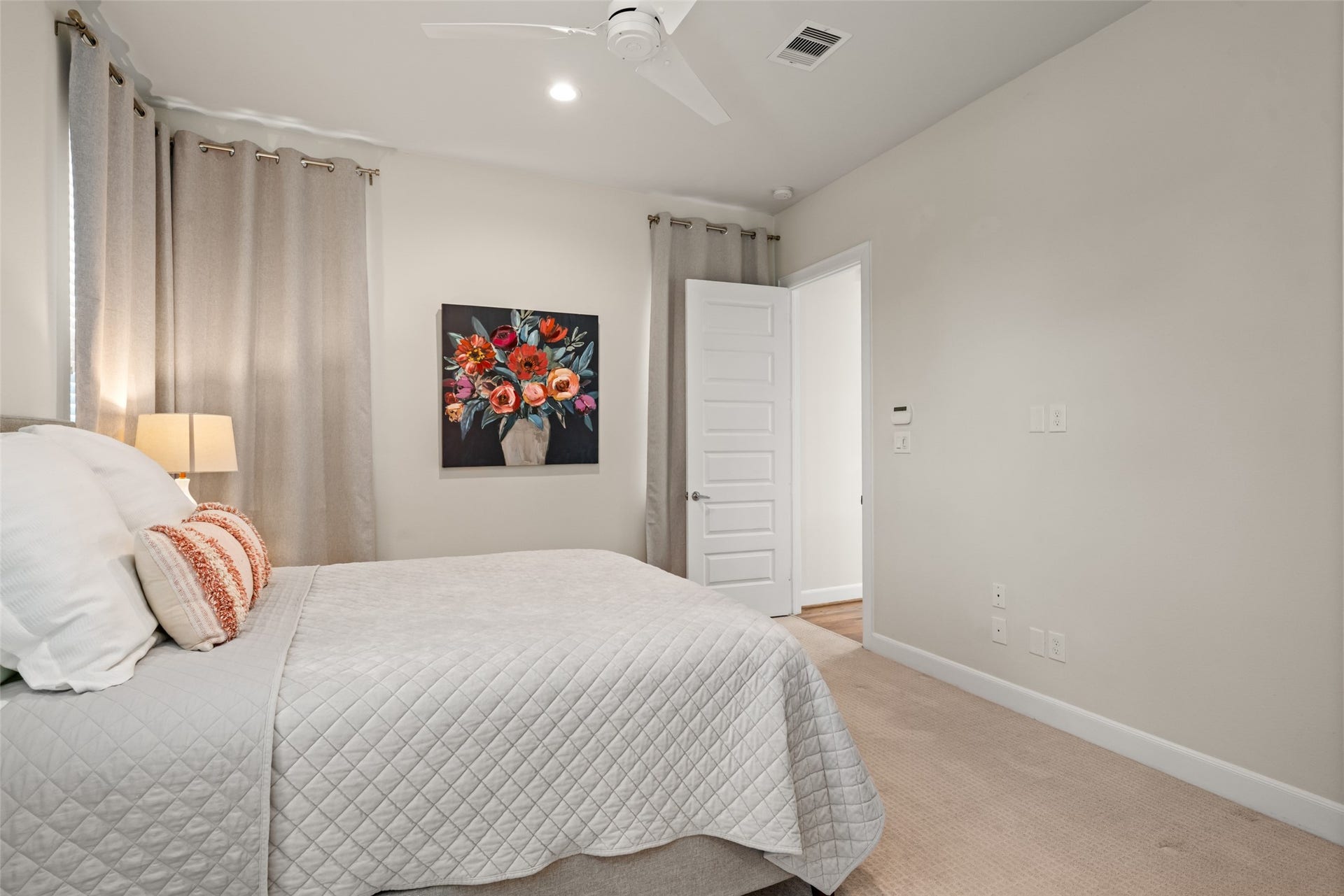 502 W Donovan Street, #A, Houston, TX 77091 The primary bedroom is tucked just off the main living area and has a ceiling fan.