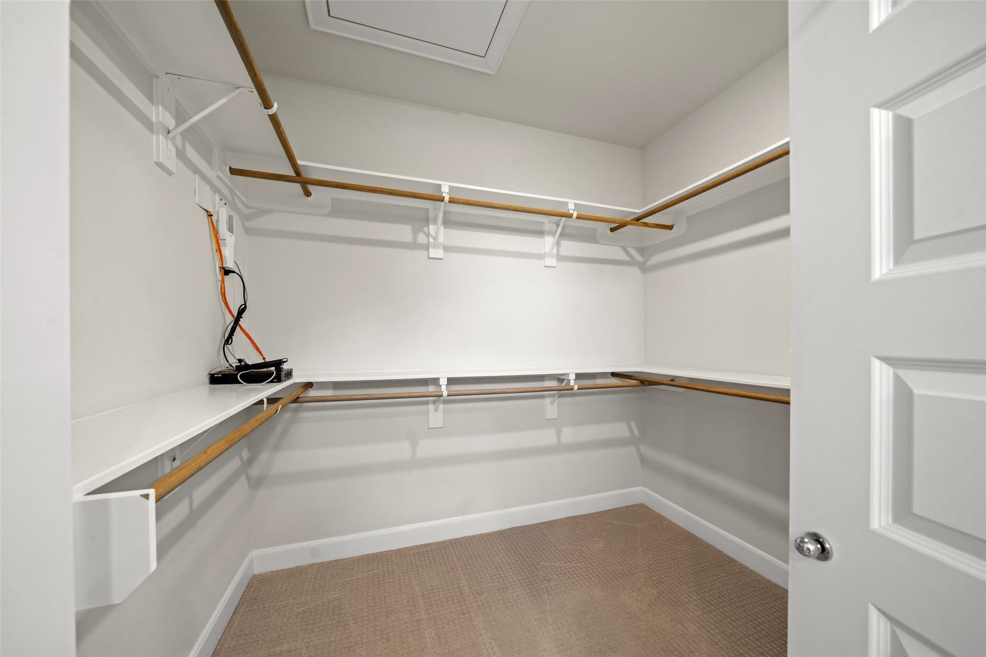 502 W Donovan Street, #A, Houston, TX 77091 Walk-in closet with hanging rods and shelving on three sides.