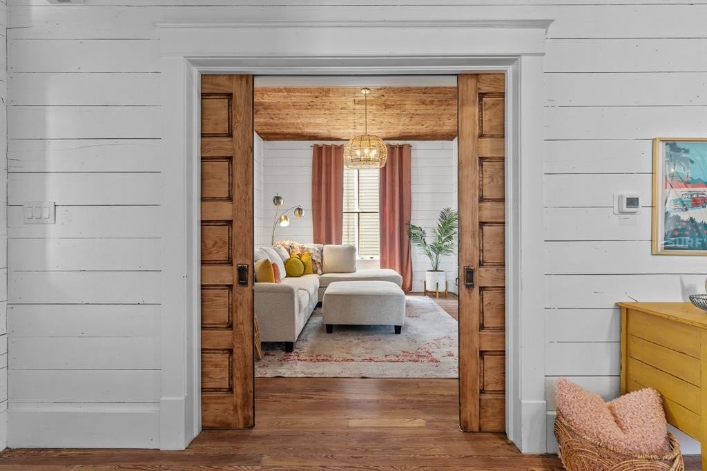 801 24th Street, Galveston, TX 77550 Double pocket doors offering privacy in the living room space
