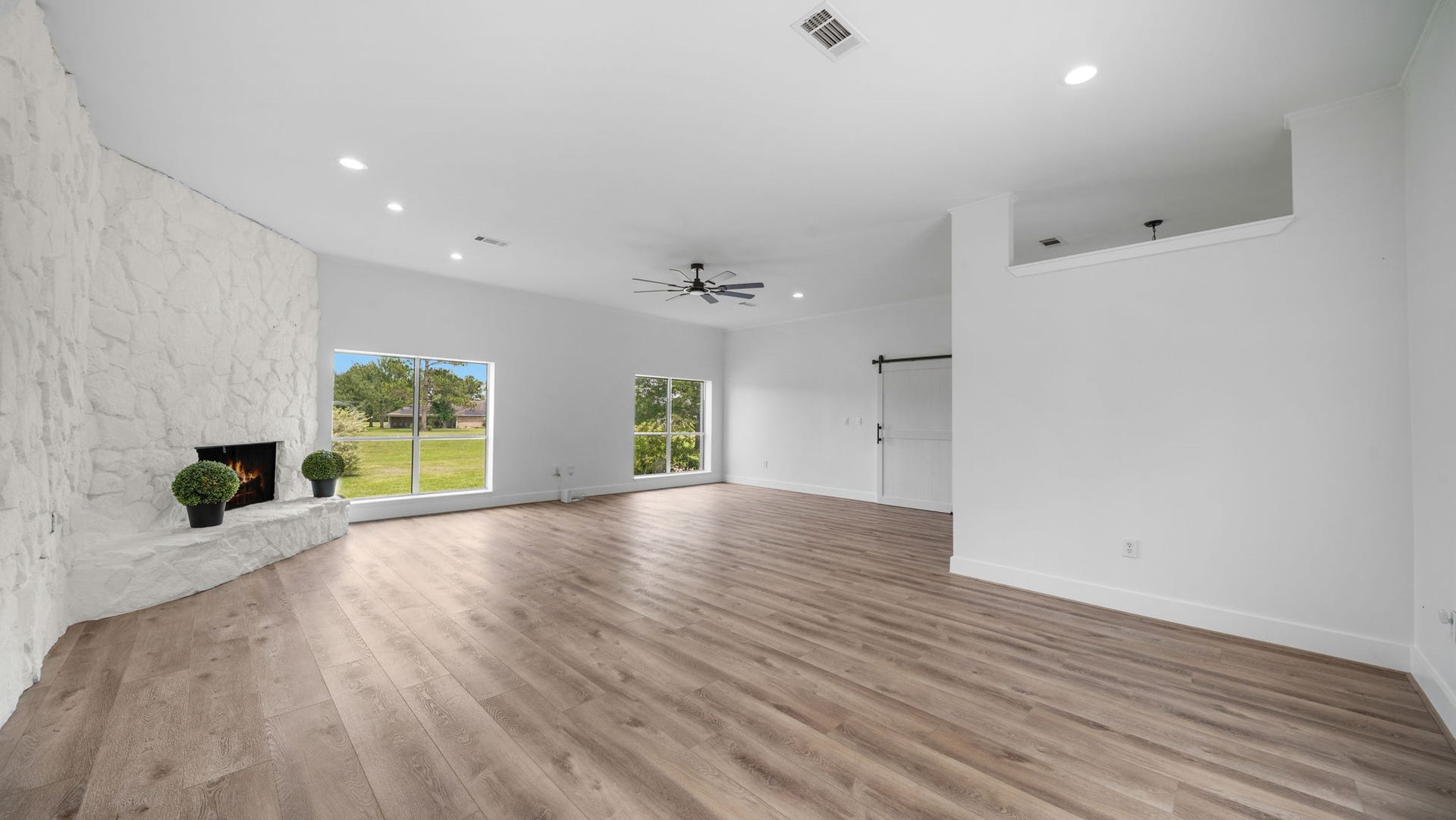 15502 Kitty Hawk Drive, Waller, TX 77484 Family room with tall ceilings with custom wood burning fireplace