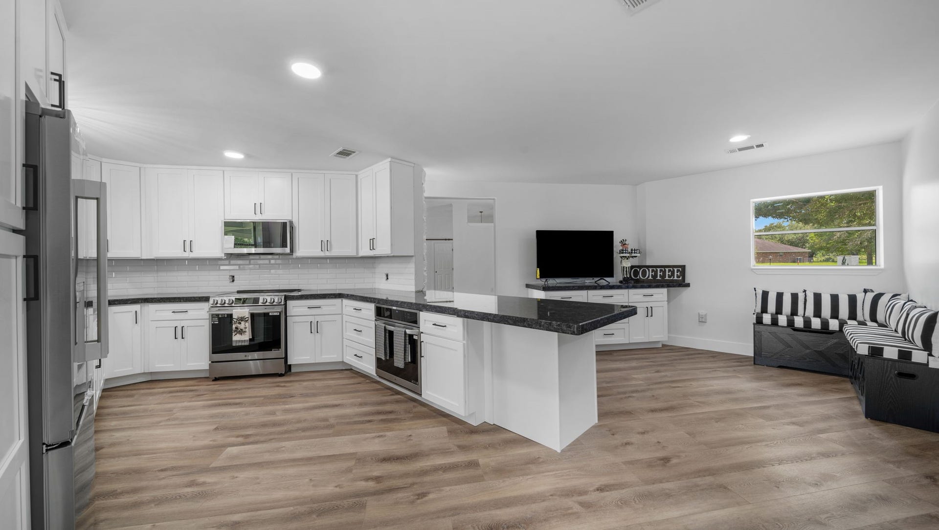 15502 Kitty Hawk Drive, Waller, TX 77484 The Kitchen so many cabinets, granite counter top space. Eat in area and bar seating, 2 convection ovens, all new appliances,