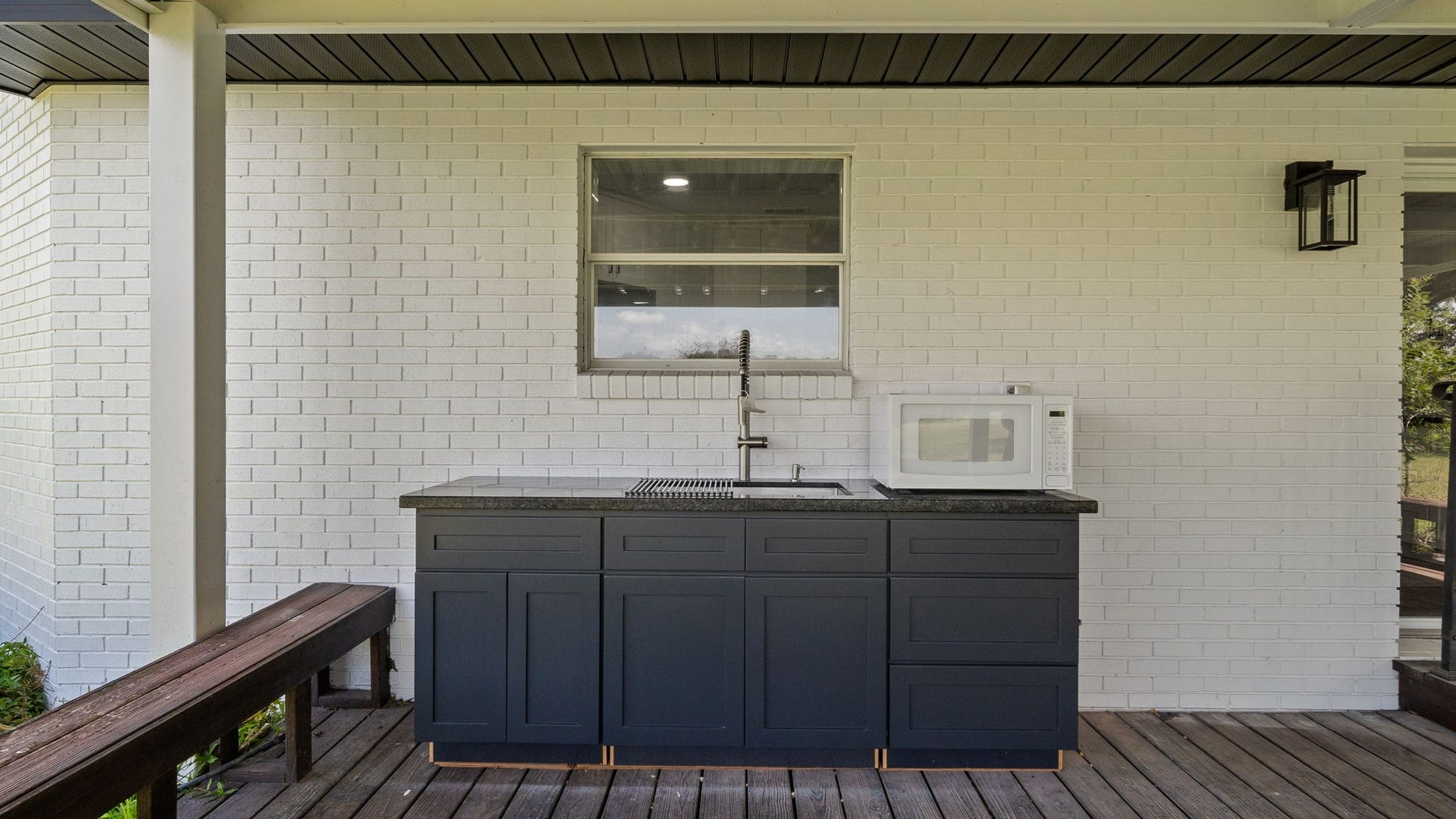 15502 Kitty Hawk Drive, Waller, TX 77484 Large prep sink,cabinets and microwave, for out side entertaining. Huge covered porch