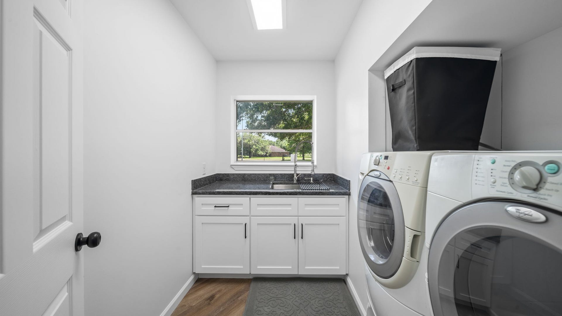 15502 Kitty Hawk Drive, Waller, TX 77484 Laundry room with deep sink and cabinets washer and dryer stay