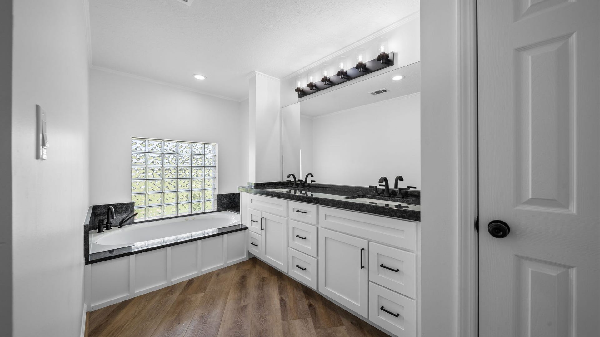 15502 Kitty Hawk Drive, Waller, TX 77484 Primary bath with jetted tub, separate large shower and large linen closet. So much storage All new double sinks cabinets, fixtures and granite throughout