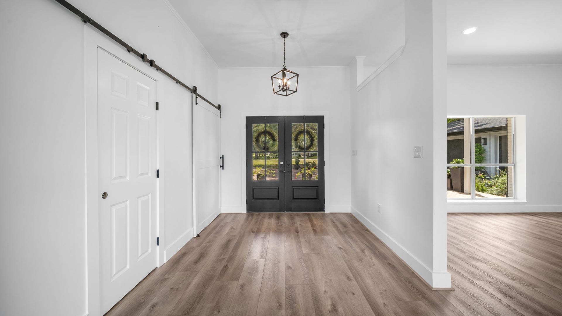 15502 Kitty Hawk Drive, Waller, TX 77484 Large entry, Barn doors closing off the bedroom hall ways for more privacy allowing more quiet time in bedrooms