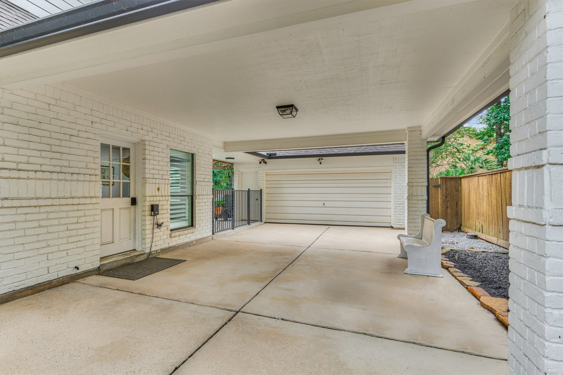 42 Golden Shadow Circle, The Woodlands, TX 77381 Convenient covered access from the porte cochere makes everyday taskslike unloading groceriescomfortable in any weather. Two car detached garage offers new opener and room for additional storage.