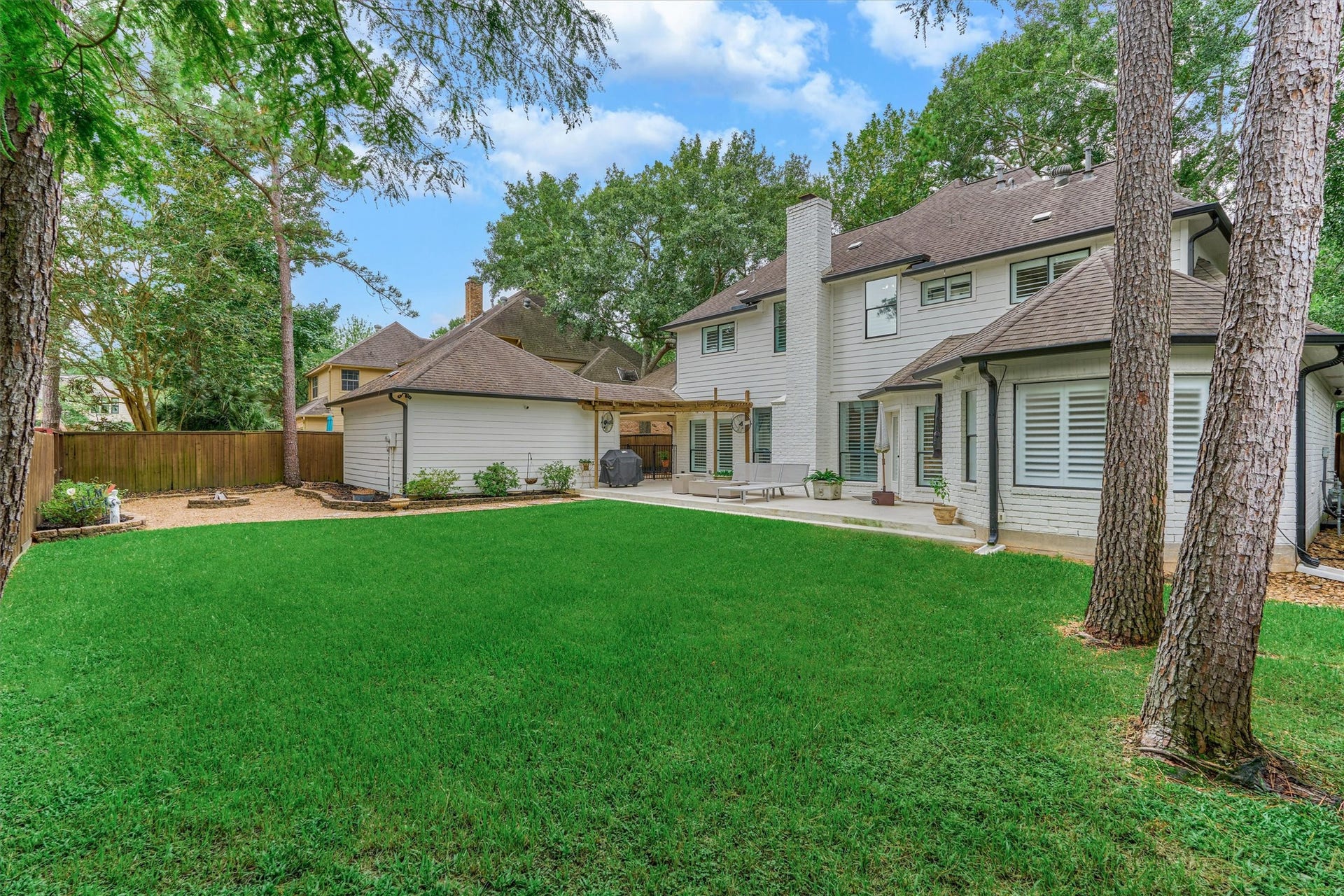 42 Golden Shadow Circle, The Woodlands, TX 77381 The tranquil backyard offers a peaceful, park-like setting.