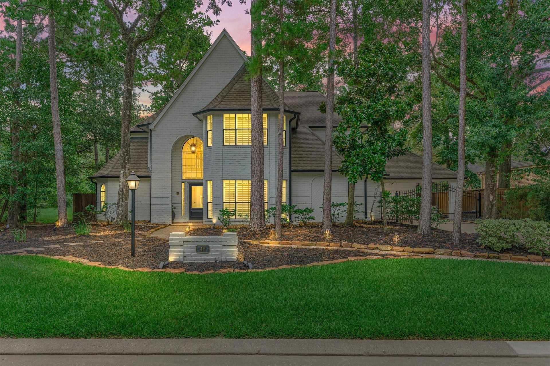 42 Golden Shadow Circle, The Woodlands, TX 77381 Experience ultimate privacy on this coveted greenbelt homesite in the heart of The Woodlands! Updated custom estate has been thoughtfully renovated throughout! Note the gated drive with porte cochere for bonus covered parking options!