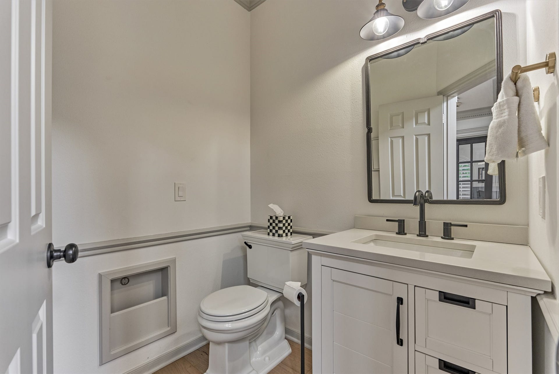 42 Golden Shadow Circle, The Woodlands, TX 77381 Modernized first floor powder bath features chic updates with extra storage options.