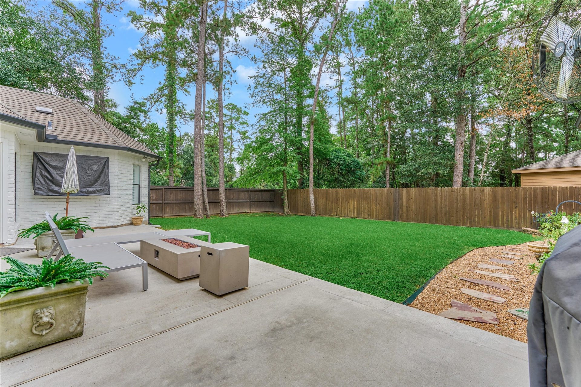 42 Golden Shadow Circle, The Woodlands, TX 77381 Step outside to your private backyard retreat, where tranquil tree-lined views create a peaceful escape.