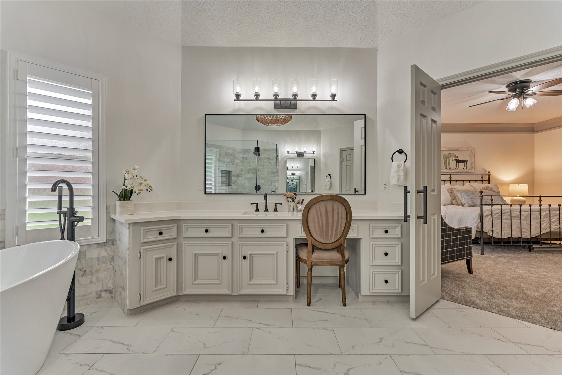42 Golden Shadow Circle, The Woodlands, TX 77381 This luxe retreat features dual sinks, a dedicated vanity area, and elegant hardware throughout.