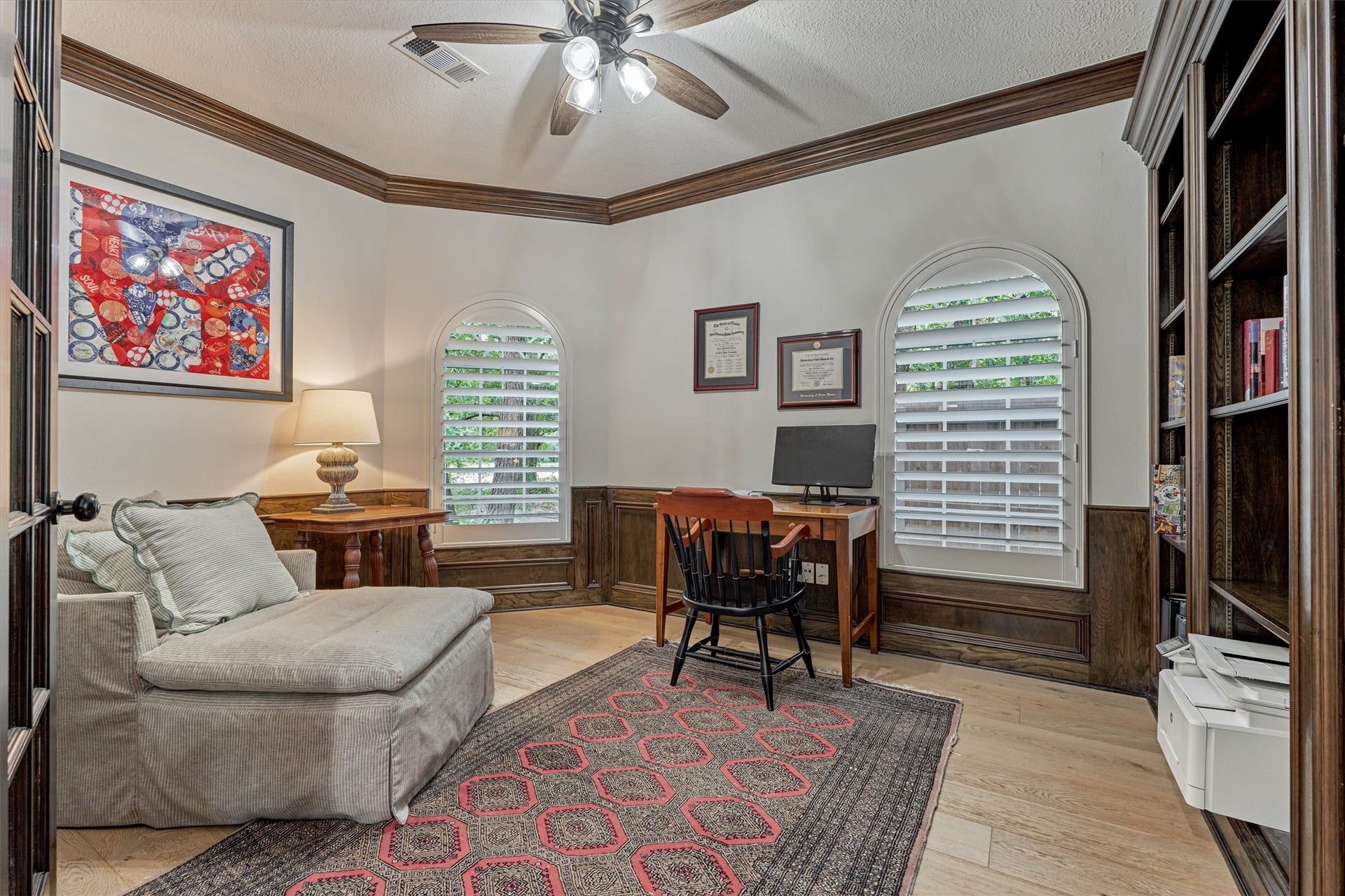42 Golden Shadow Circle, The Woodlands, TX 77381 Sophisticated paneled study, along the primary bedroom wing of the home, boasts a wall of custom built-ins.