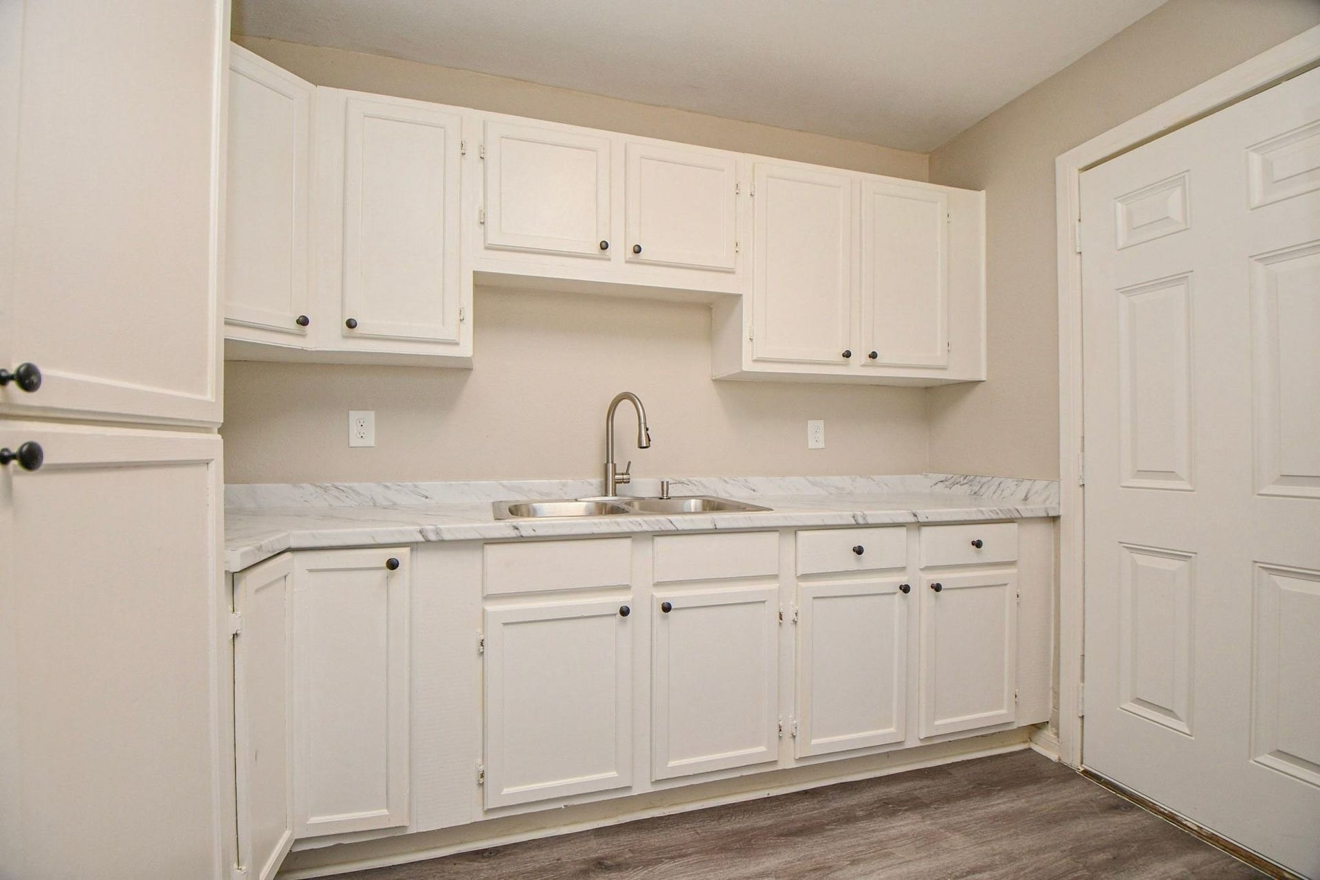 Ample whiite cabinet storage.