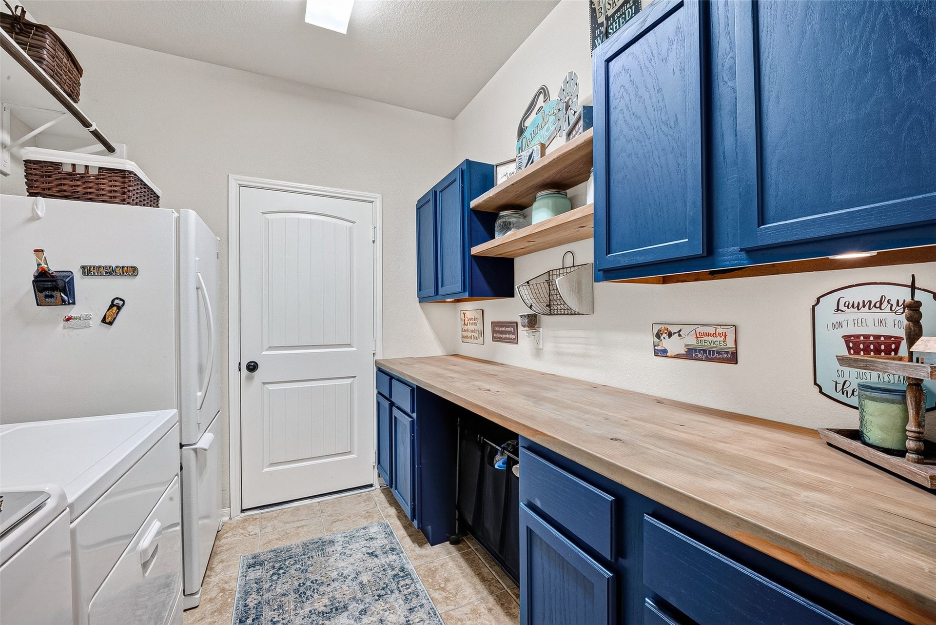 2414 Alexandra, Deer Park, TX 77536 Upscale Laundry Design Featuring Abundate Cabinets and a Stylish Butcher Block Inspired Counter, Offering Plenty Of Imagination For Creating Your Ideal Organizational Setup