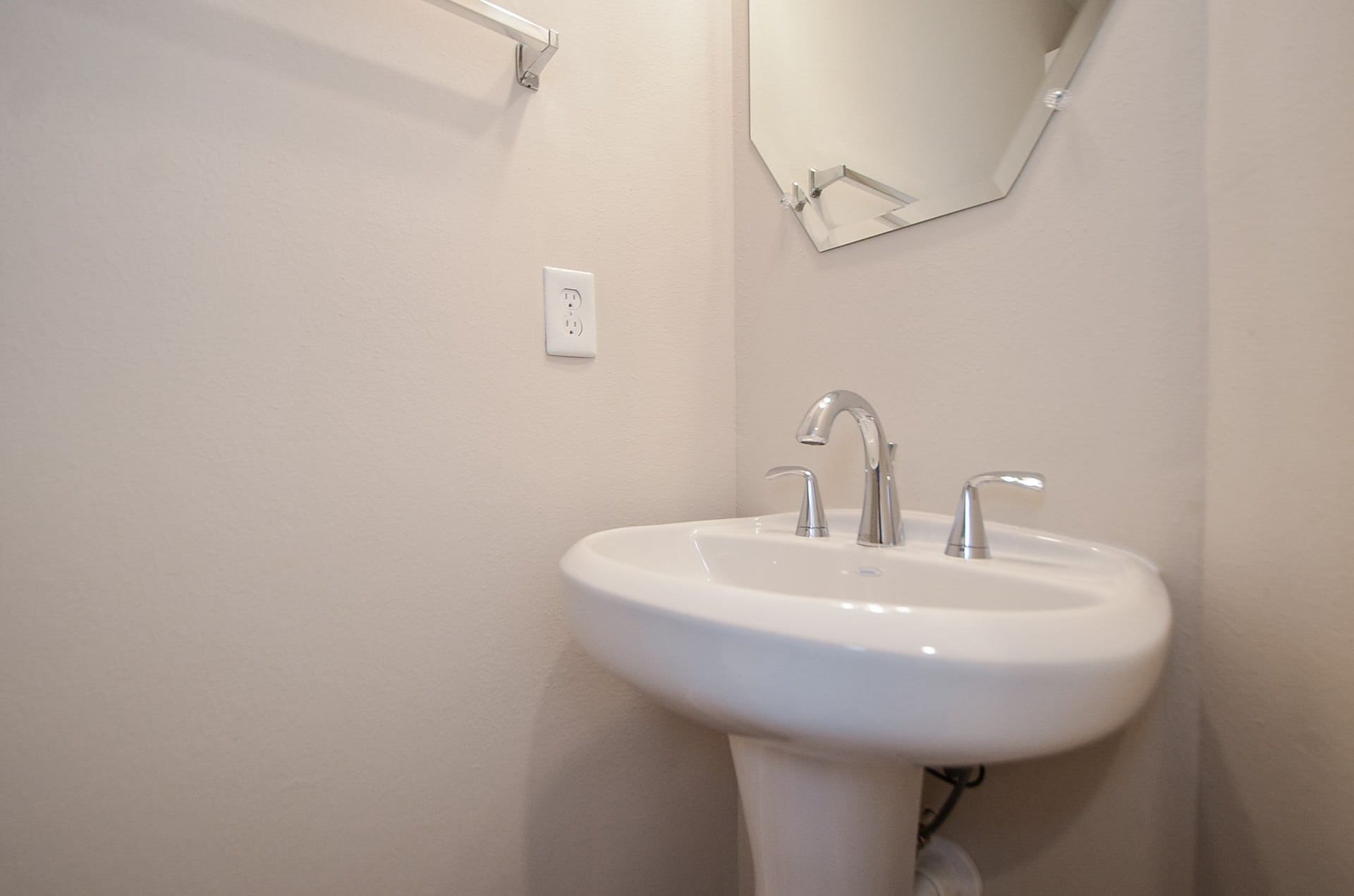 The first floor provides a half bath with a pedestal sink 





















































































































]