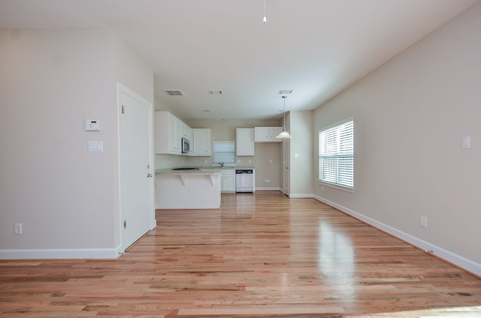 924 E 39th Street, Houston, TX 77022 An additional view from the living area into the kitchen. The door to the left leads into the garage.