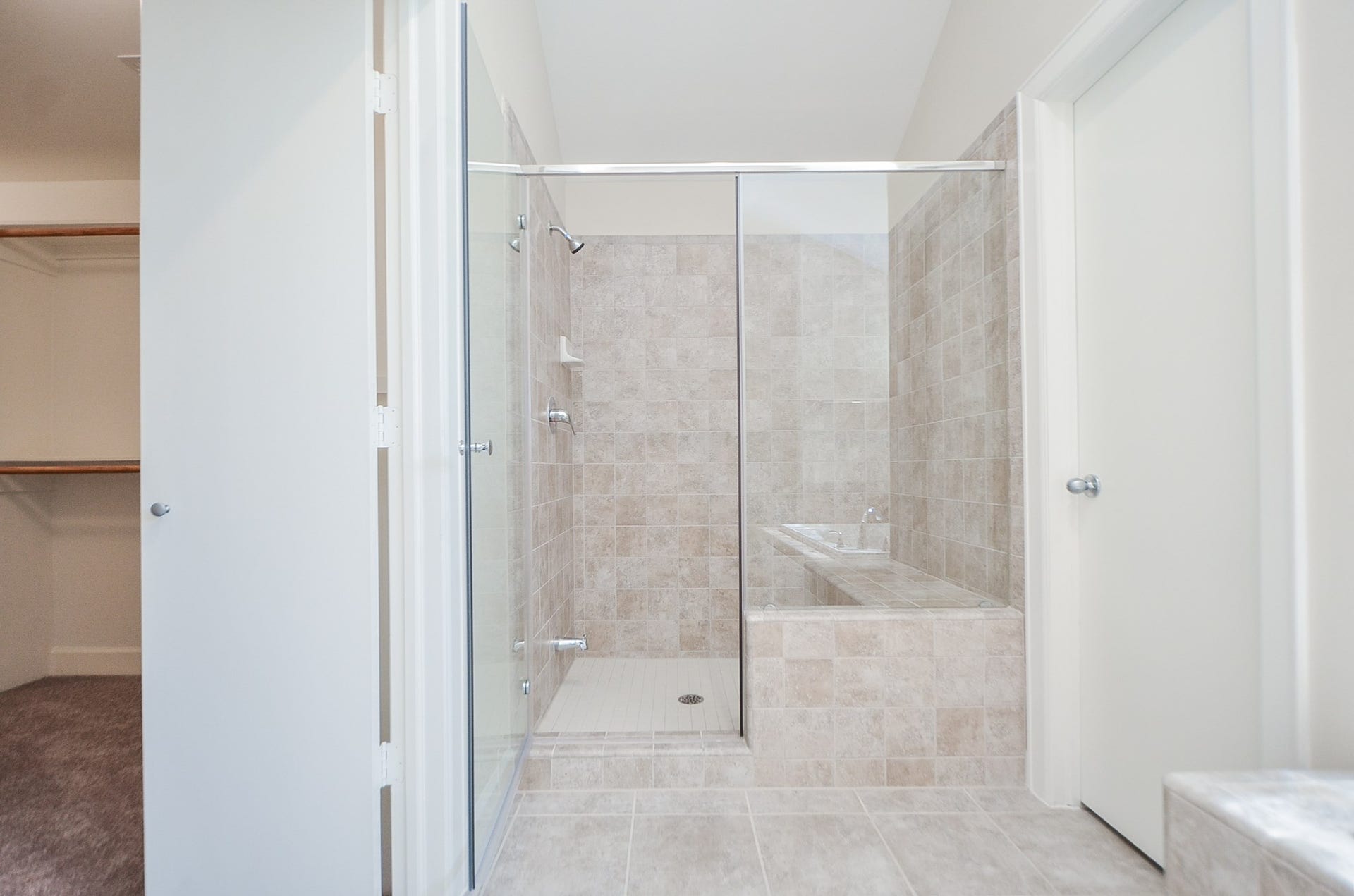 924 E 39th Street, Houston, TX 77022 Additional view of the shower with the closet to the left and toilet behind the closed door.