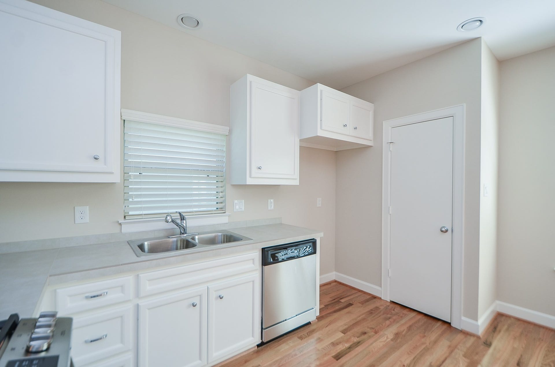924 E 39th Street, Houston, TX 77022 All appliances are conveyed with the home including washer and dryer. Photo is from previous listing and does not show stainless steel refrigerator currently in home. The pantry is located behind the door currently in view.