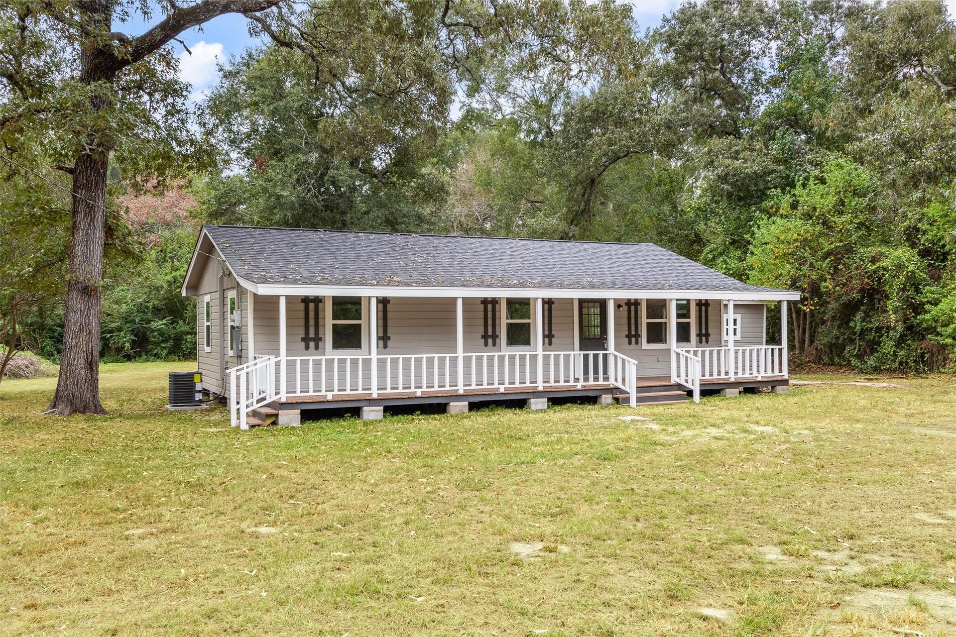 8627 S Fork Drive, Conroe, TX 77303 Welcome Home! Charming curb appeal welcomes you to this cute home featuring an expansive covered front porchperfect for relaxing and enjoying the peaceful surroundings. Situated on 1.61 acres, this property offers space, privacy, and plenty of room to make it your own.