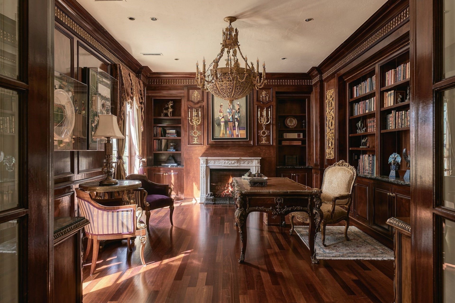 2115 River Oaks Boulevard, Houston, TX 77019 Library off the main entry with custom mahogany cabinetry and rich wood floors.