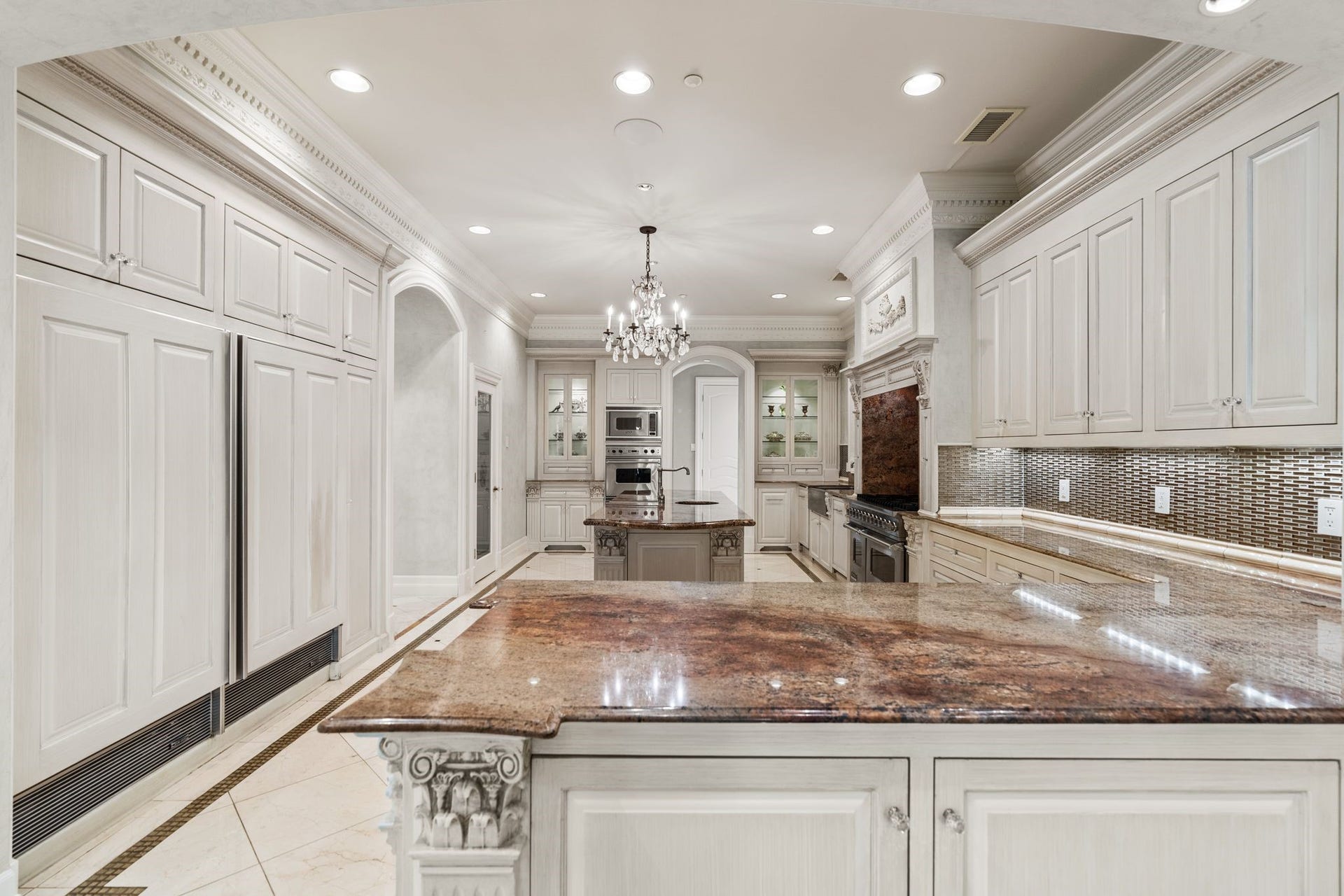 2115 River Oaks Boulevard, Houston, TX 77019 Generous counter space and extensive cabinetry provide room for preparation and service, supporting both everyday meals and larger gatherings.