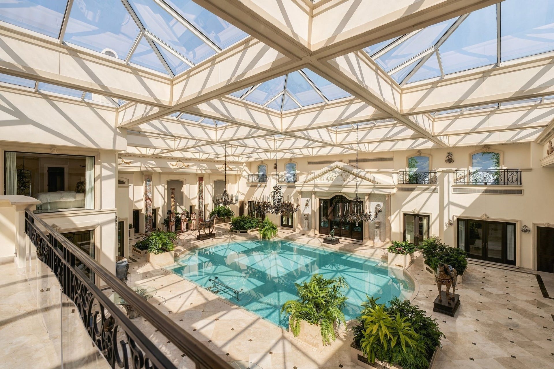 2115 River Oaks Boulevard, Houston, TX 77019 The primary bedroom upper gallery views of the atrium, pool pavilion.