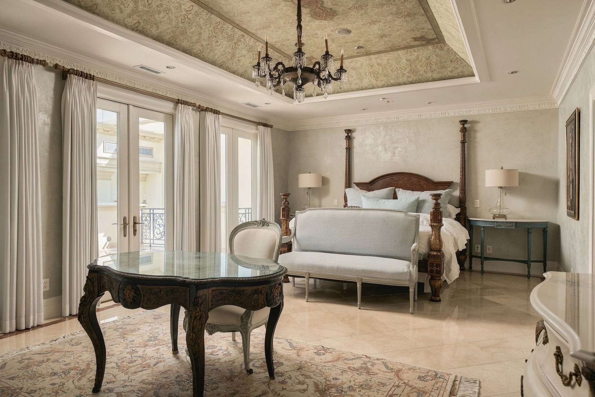 2115 River Oaks Boulevard, Houston, TX 77019 The primary bedroom with venetian plaster walls, timeless crown molding with glass doors opening toward the atrium gallery.