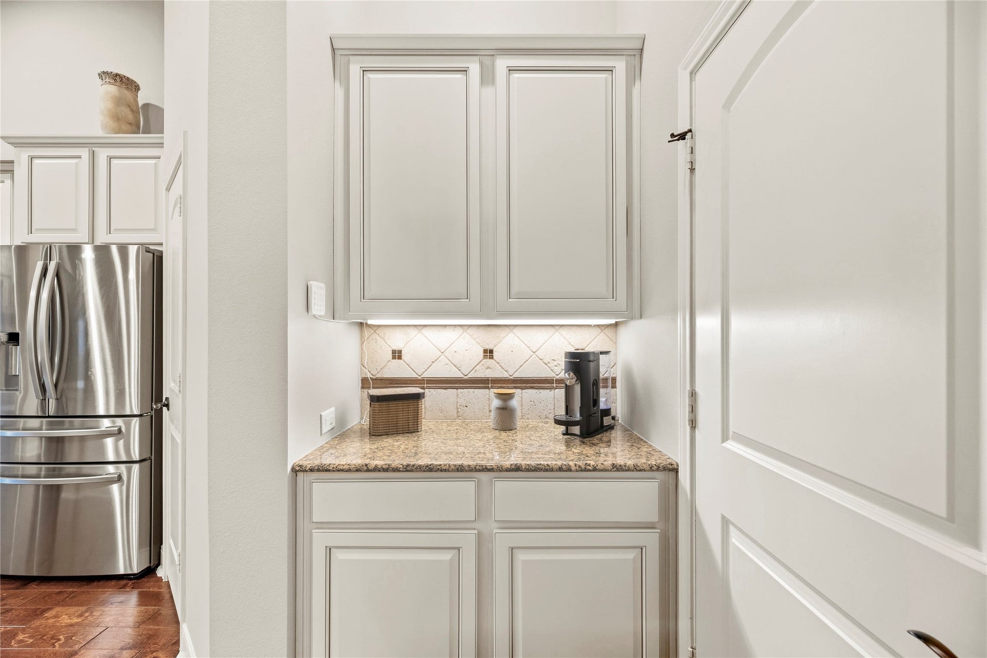 8623 Crescent Spur Drive, Richmond, TX 77406 The butler's pantry adds extra cabinetry and prep space, making dinner parties and holiday hosting effortless.