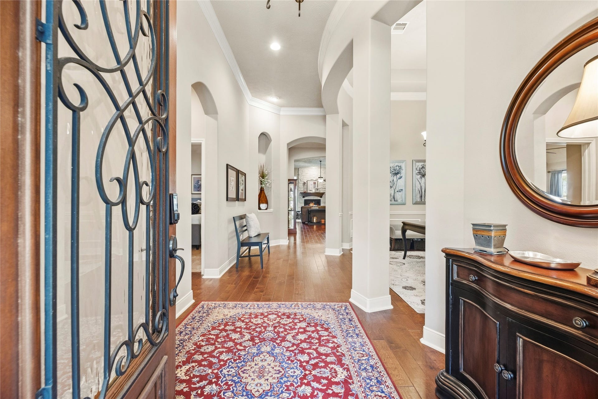 8623 Crescent Spur Drive, Richmond, TX 77406 Step through the wrought iron door into a stately foyer with rich hardwood floors and soaring ceilings that welcome you in.