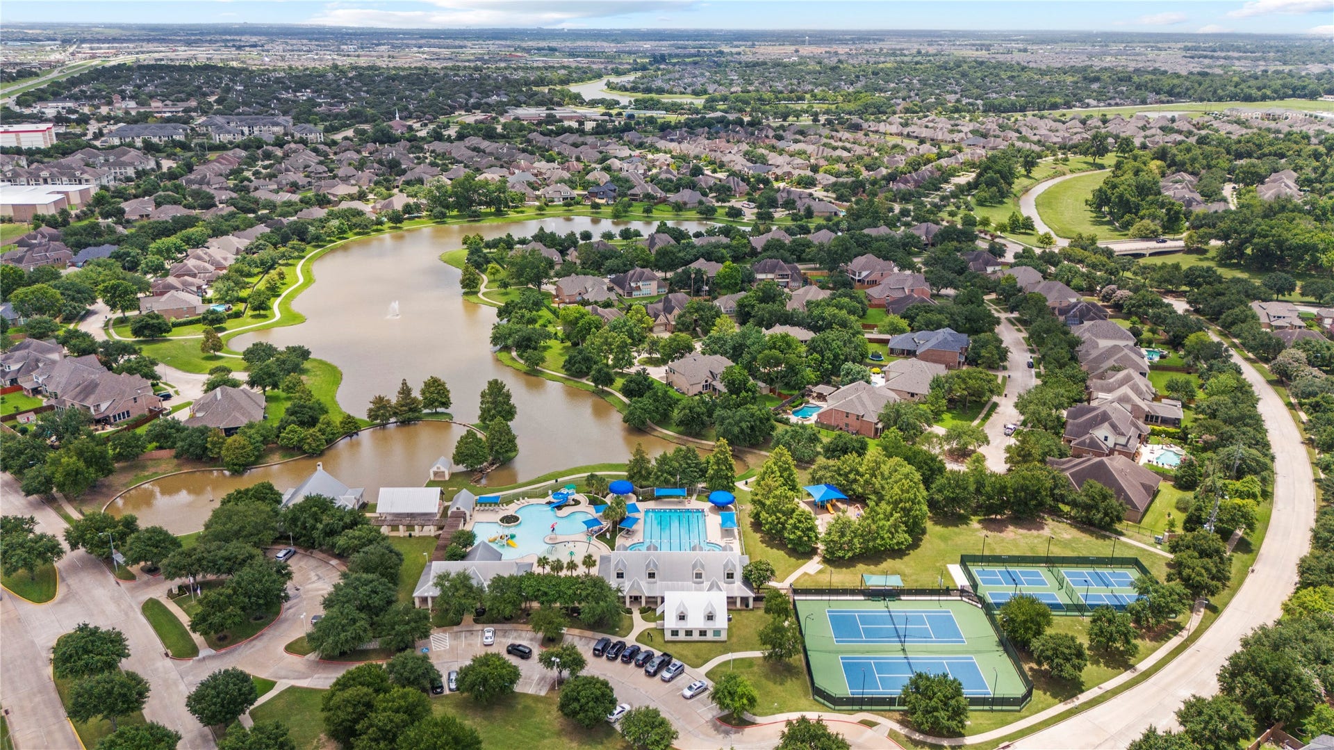 8623 Crescent Spur Drive, Richmond, TX 77406 An aerial view showcases the tree lined streets, sparkling lakes and green spaces of this beautiful master planned community.