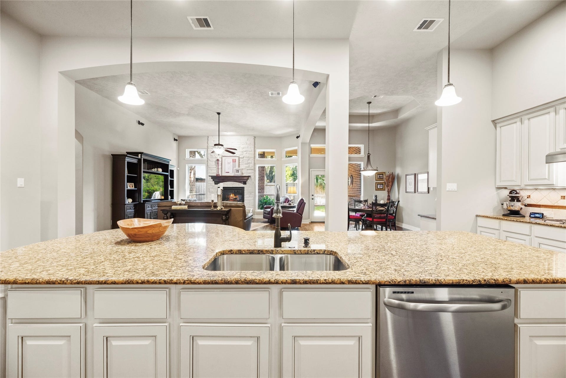 8623 Crescent Spur Drive, Richmond, TX 77406 Abundant counter space and cabinetry with open views to the living areas mean the cook never misses a moment.