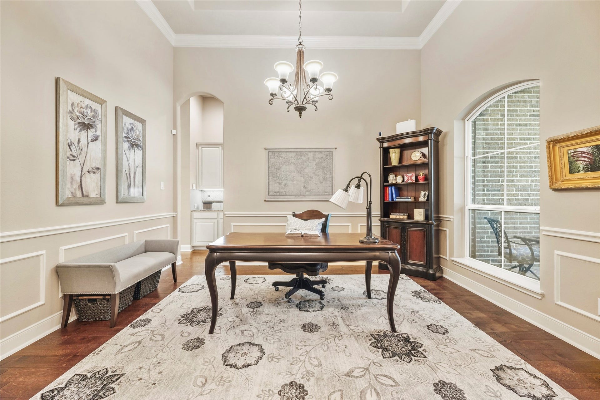 8623 Crescent Spur Drive, Richmond, TX 77406 The formal dining room, finished with a chandelier and crown molding, is flexible enough to serve as a refined home office.