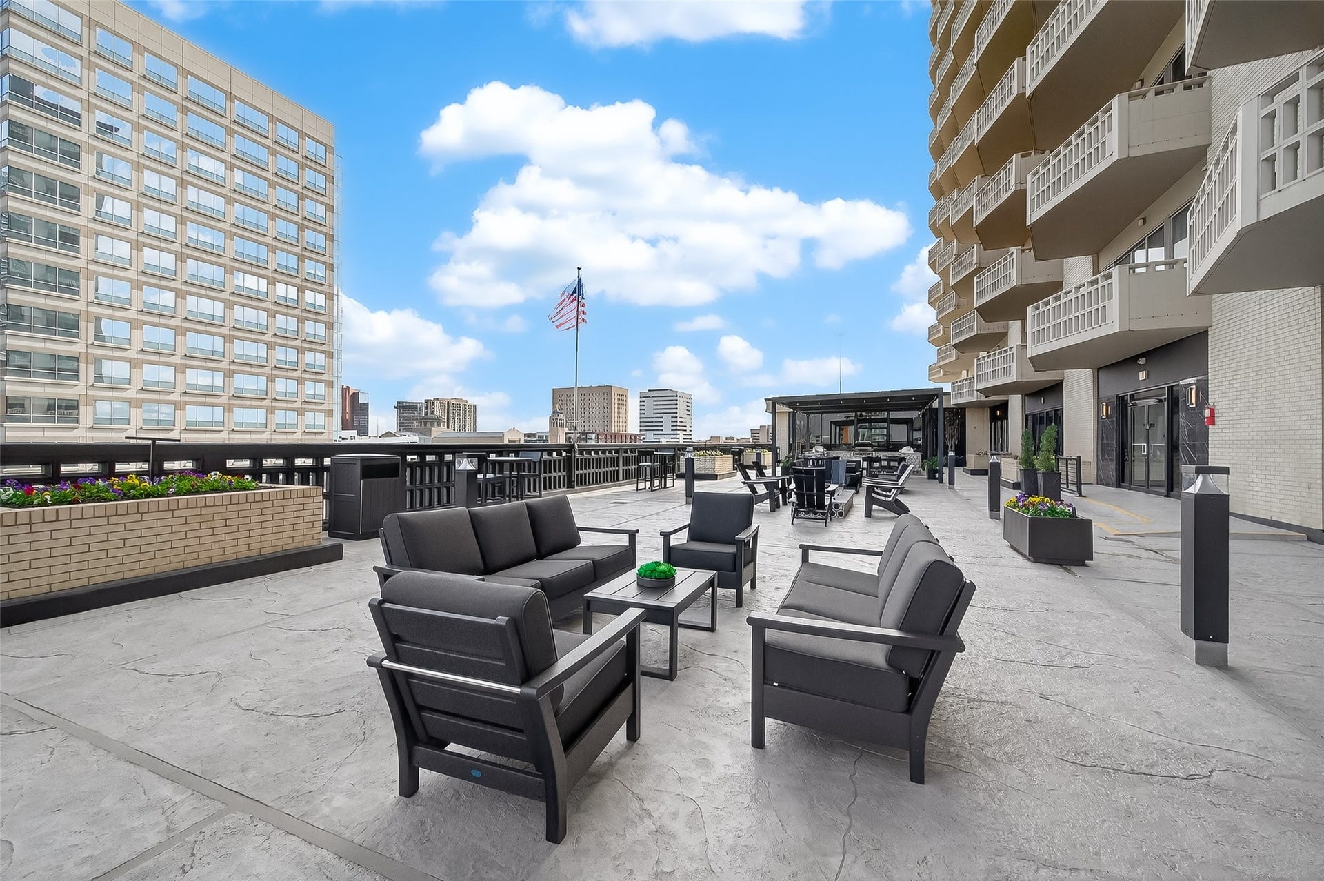 2016 Main Street, #PH 3, Houston, TX 77002 Spacious urban terrace featuring modern outdoor seating and stunning city views, perfect for relaxation and entertaining.